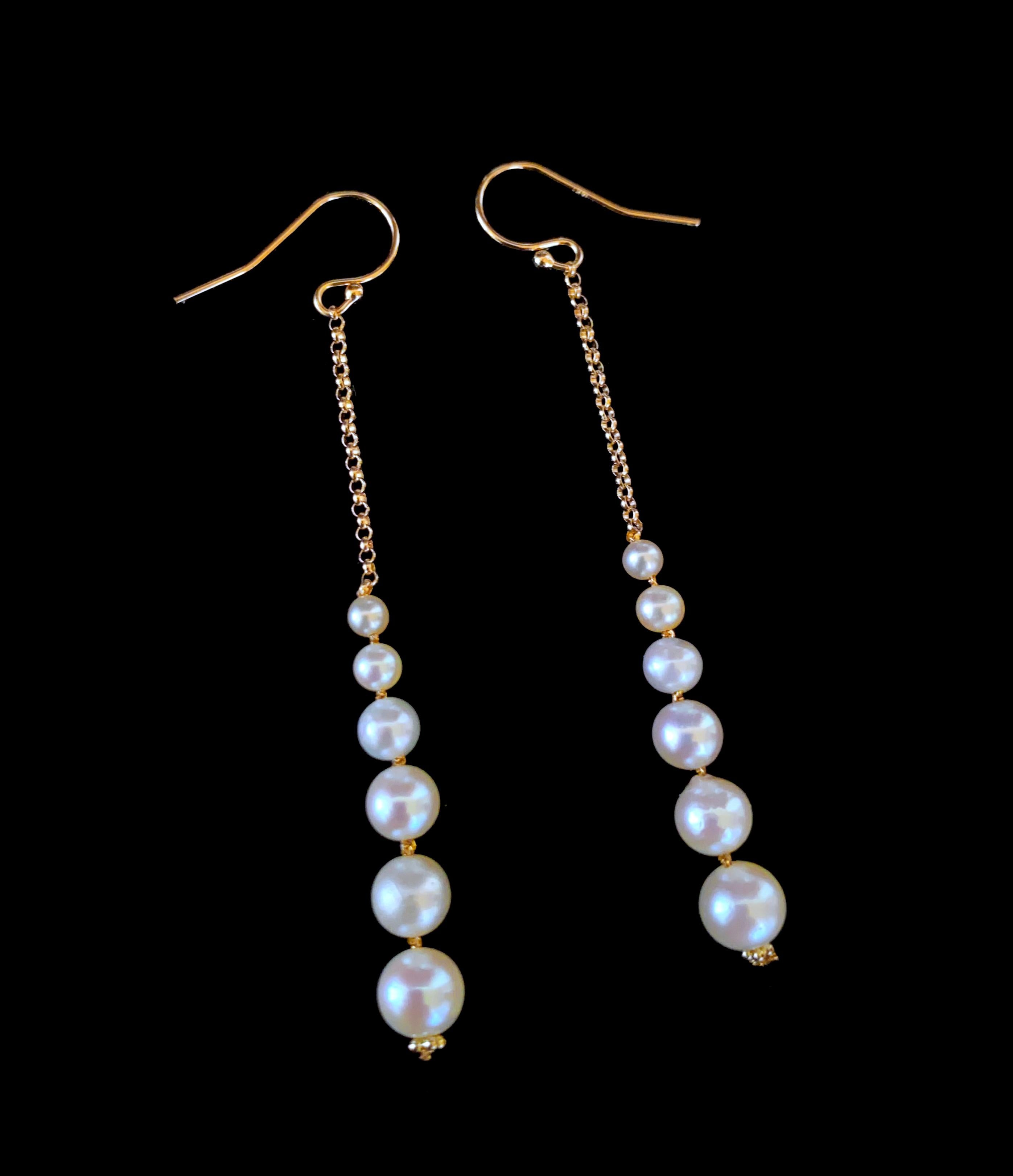 Simple and classy pair of Earrings by Marina J. This lovely pair is made of all solid 14k Yellow Gold chain and hooks. A row of Pearls Graduating in size hang off solid 14k Yellow Gold Chain. The white Pearls display a soft iridescent luster that is