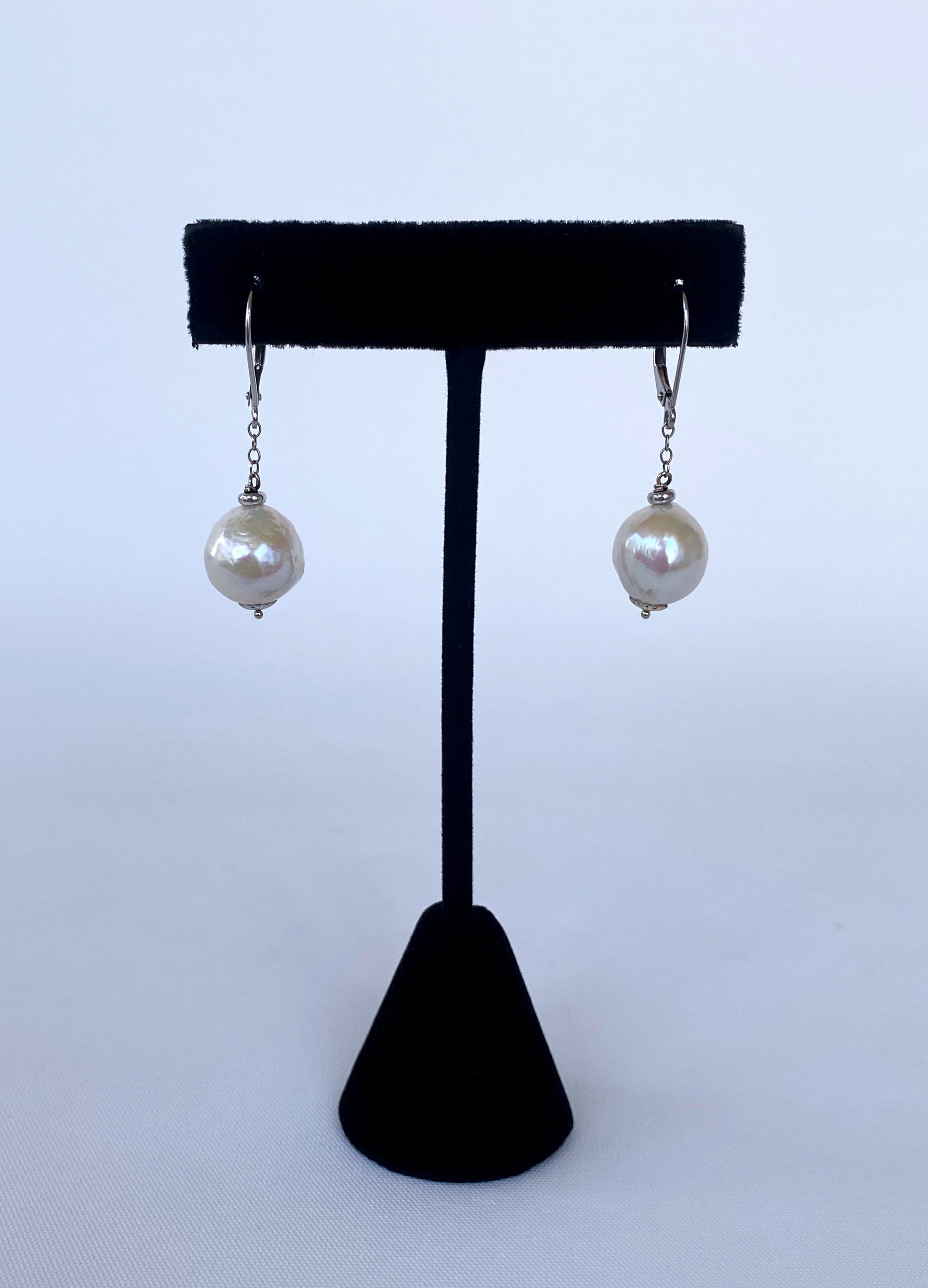 white pearl earrings hanging