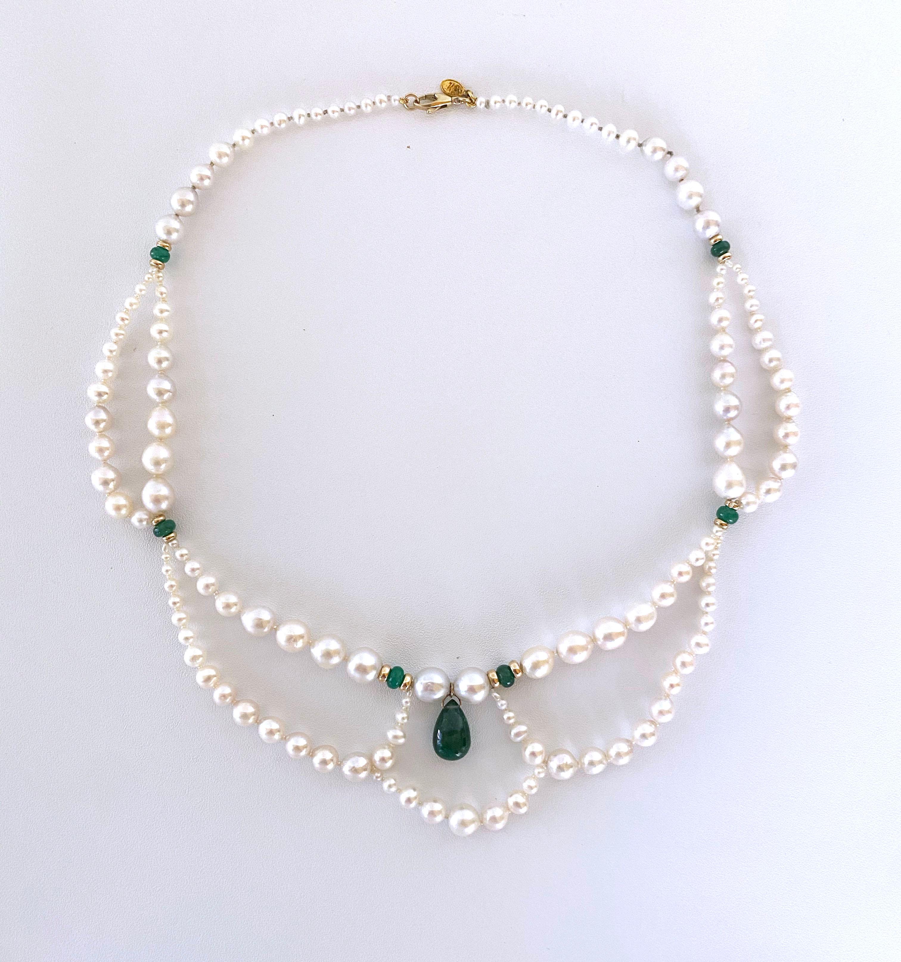 Classic Victorian inspired necklace all handmade by Marina J. This gorgeous piece features Graduated Drapes made with beautiful high luster white/cream Pearls, featuring a vibrant Emerald teardrop Centerpiece, all adorned with Emerald & 14K Yellow