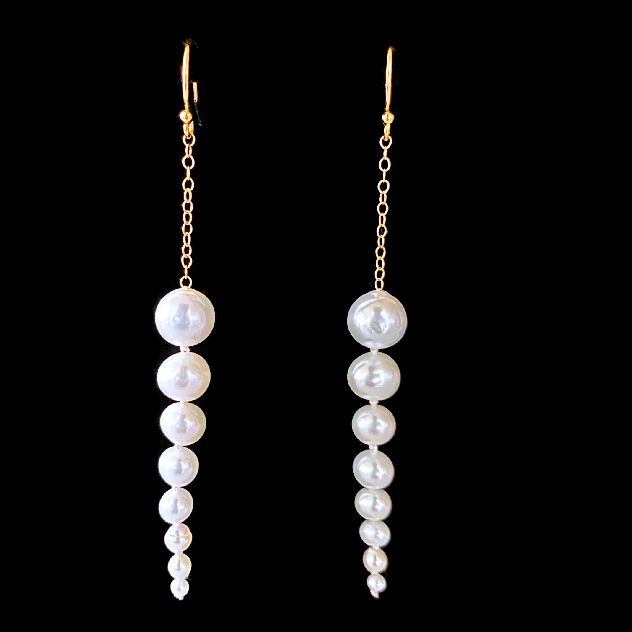 Simple, sexy and chic pair of Earrings by Marina J. This pair is made using multi sized Pearls strung together into a Graduating / Tapered line, which hang off solid 14k Yellow Gold chain. Measuring XX Inches long, this pair hang off solid 14k