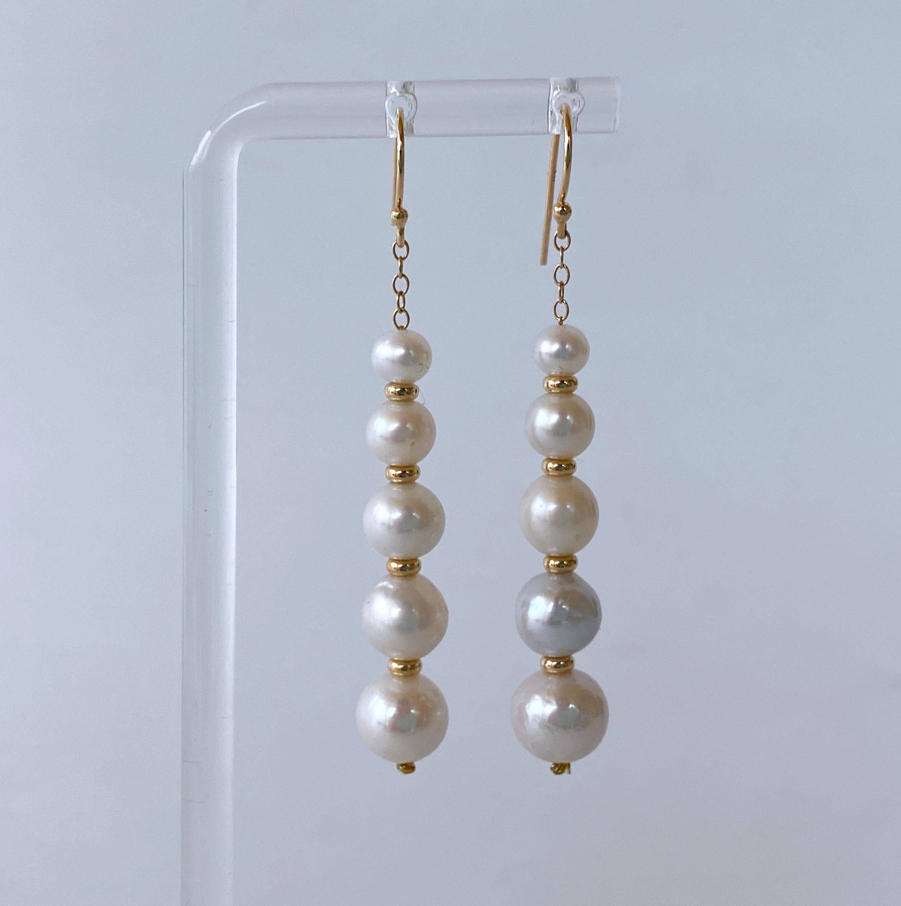 Beautiful and Elegant pair of Earrings by Marina J. This pair is made with all solid 14k Yellow Gold chain, hooks and beads. A row of Pearls Graduating in size hang off solid 14k Yellow Gold Chain. The white Pearls display a soft iridescent luster