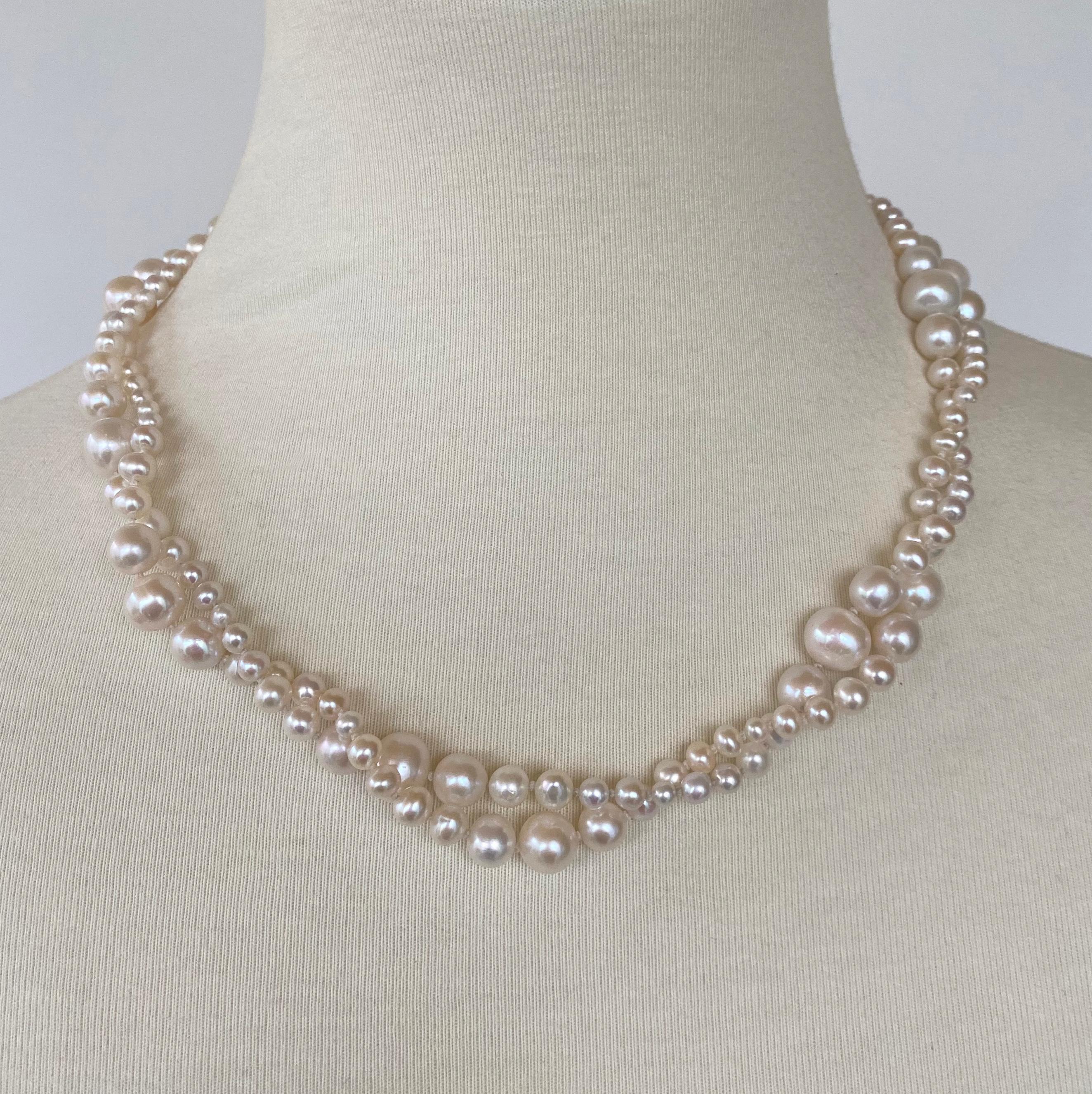 Gorgeous Graduated Pearl strung necklace designed by Marina J. This piece features all round Cultured Pearls displaying a vivid white color and soft luster. This wonderful piece is strung with multiple graduations, giving a contemporary feel to a
