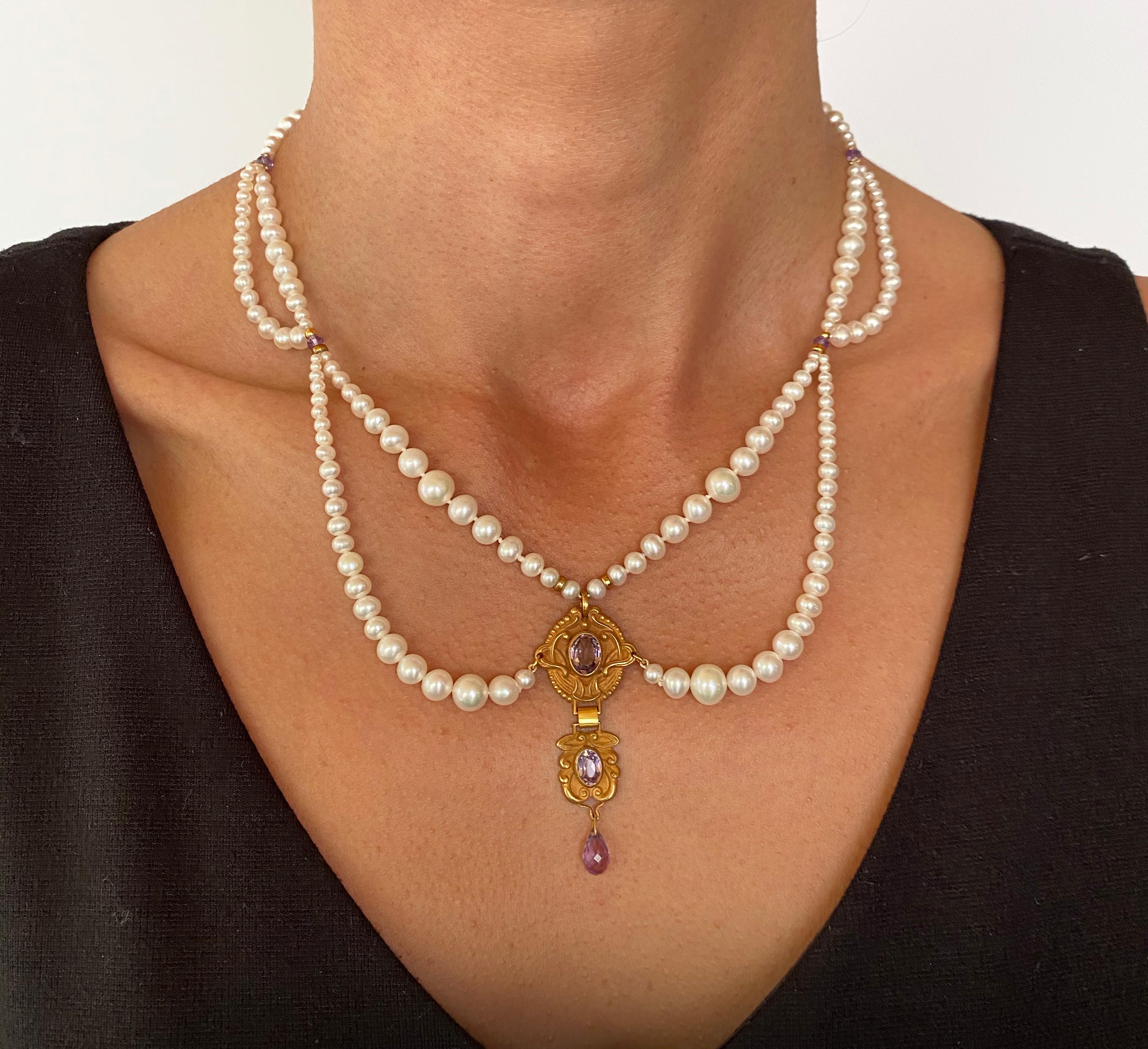 This is a pearl necklace with 2 graduated loops to highlight the collar bone. The double pendant is vintage with beautiful amethyst stones. The length of the necklace is 16.75 inches to accent the elegance of your neck. There is a 14k gold clasp to