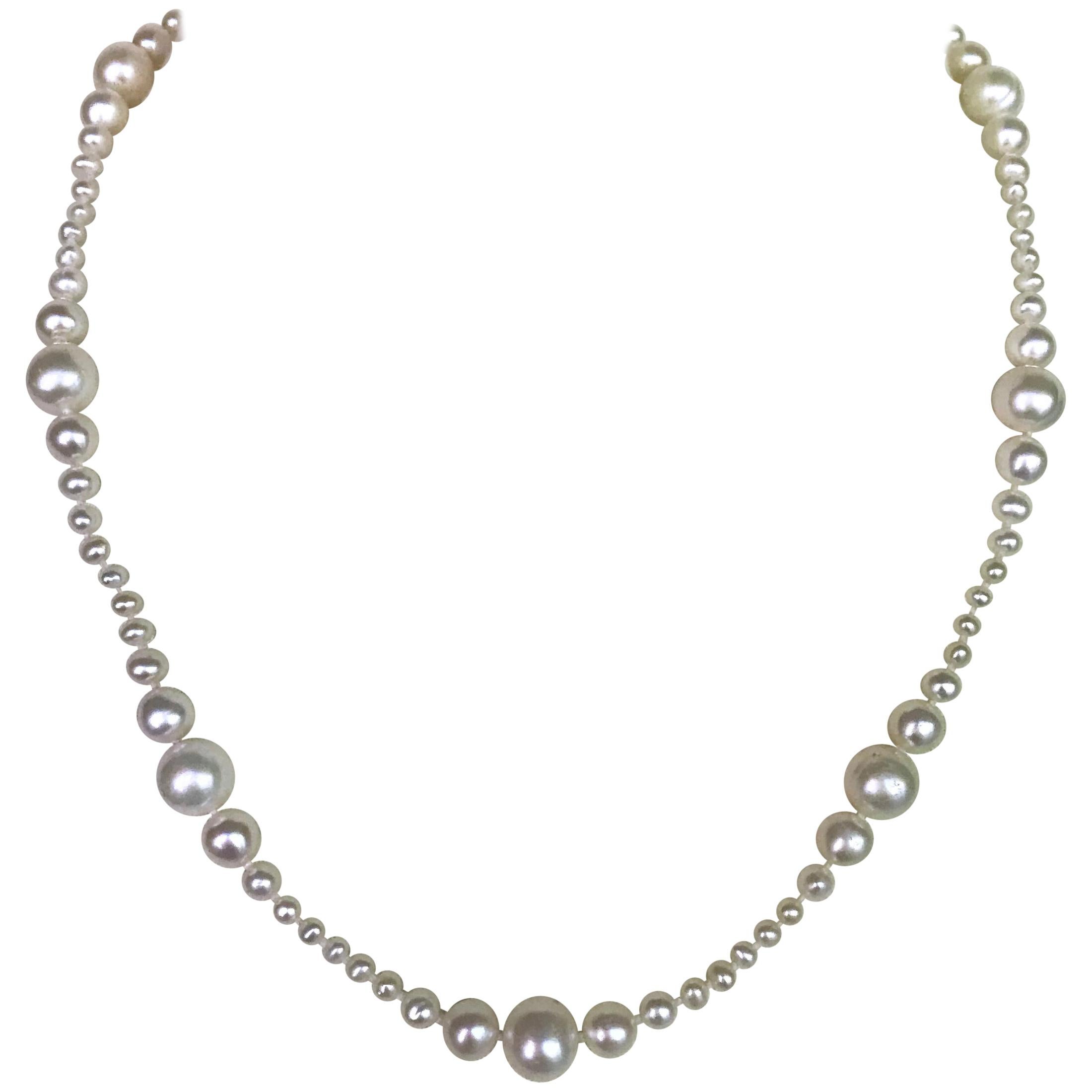 This beautiful classic graduated version of the white pearl necklace was handmade and handpicked by Marina J. to create a perfectly graduated necklace. The pearl beads measure from 1.5 to 8 mm. This necklace measures 21