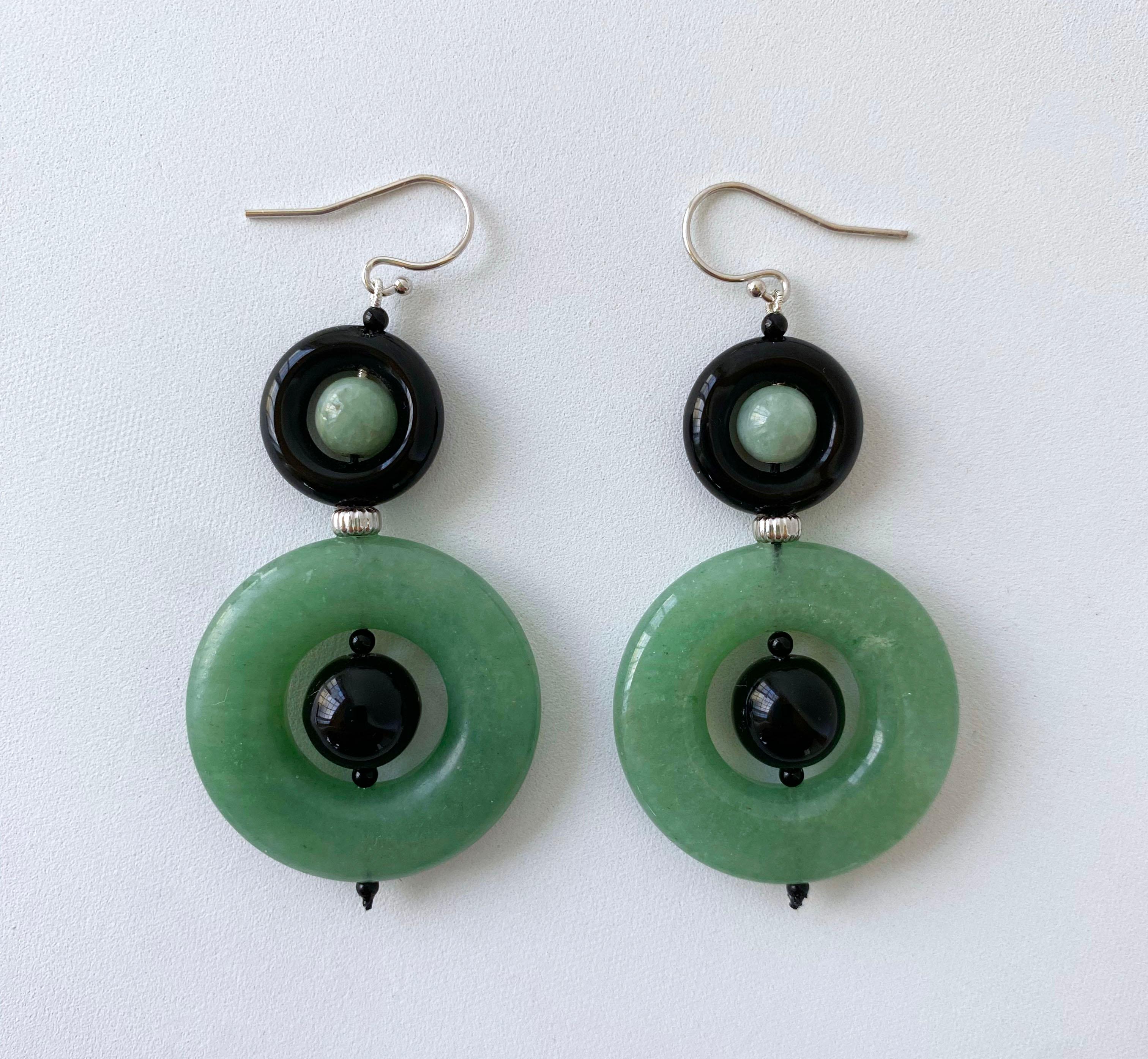 Gorgeous pair of Earrings by Marina J. This pair is made using all solid 14k White Gold wiring and hooks. A small round Jade bead sits within a high gloss Black Onyx Donut from which a larger Jade Donut & Black Onyx bead hang. A solid 14k White Gold