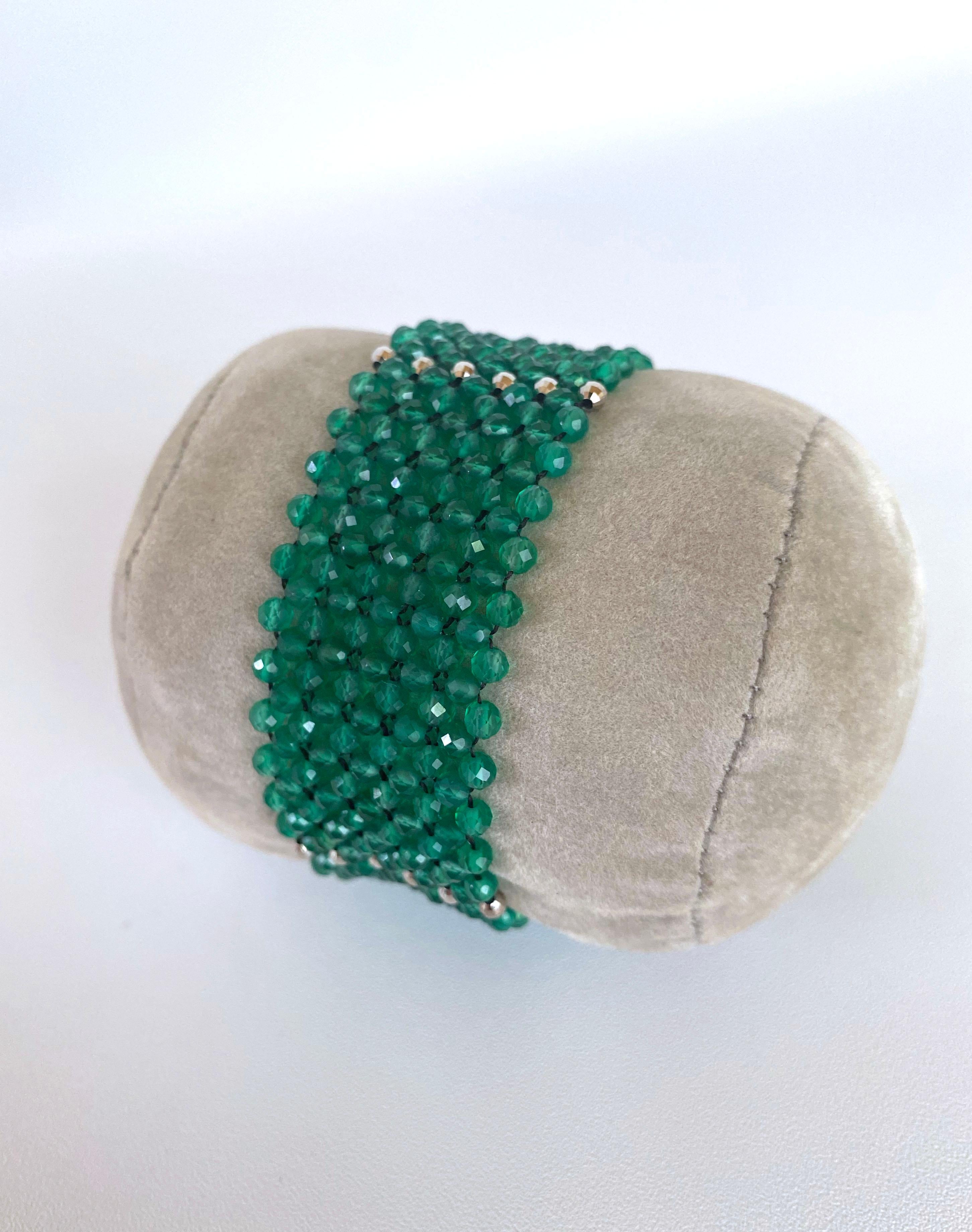 Gorgeous piece all hand woven and made by Marina J. This brilliant bracelet features amazing faceted Green Onyx beads which display a great translucency and radiance, perfectly adorned by Rhodium plated Sterling Silver accents. Measuring 6.75 inches