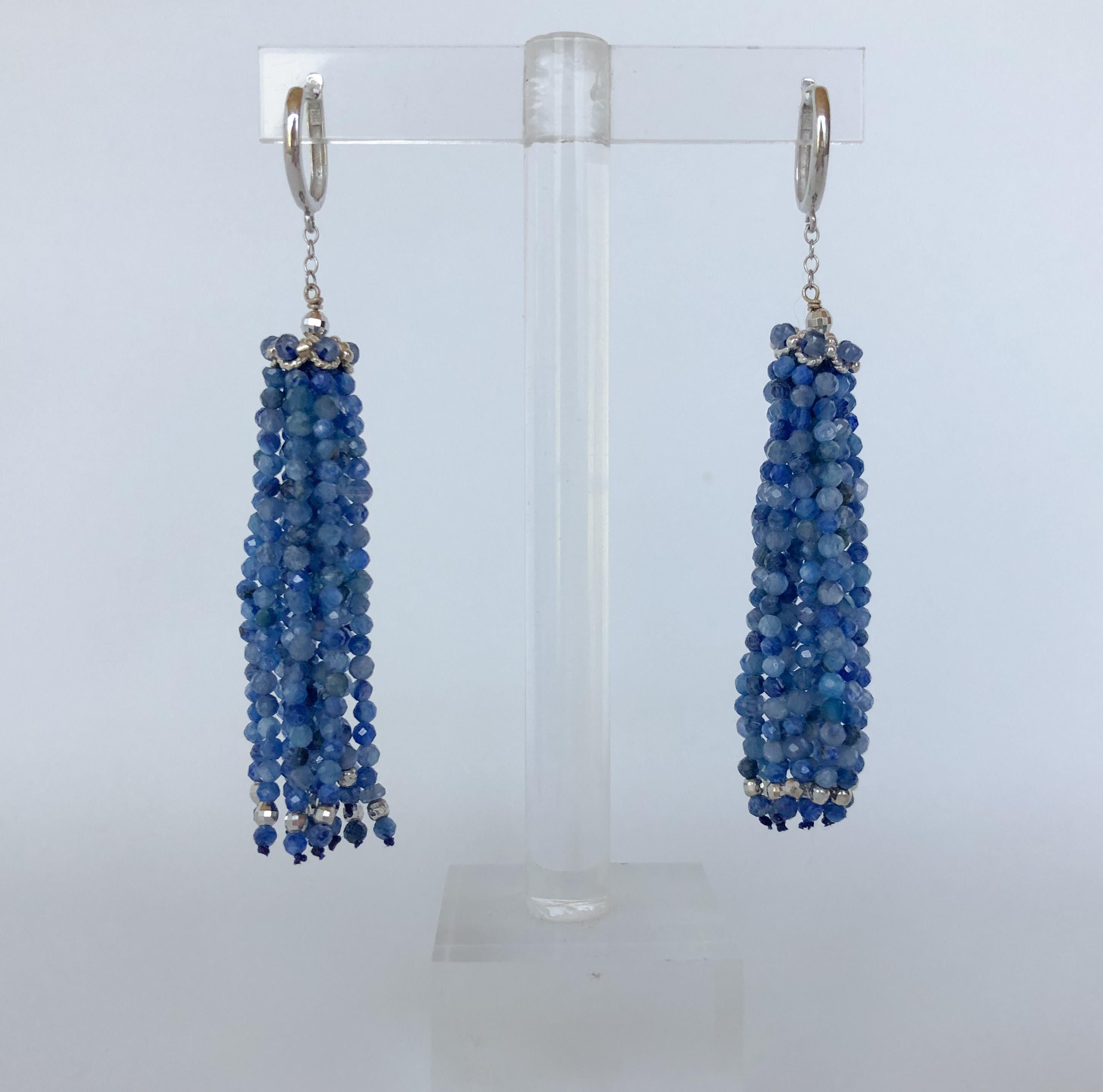 These gorgeous earrings are made with different shades of kyanite beads and 14k faceted beads. The top of the earring features a 14k white gold cup and the lever-backs and chain are also made of 14k white gold. They earrings are about 2.75 inches