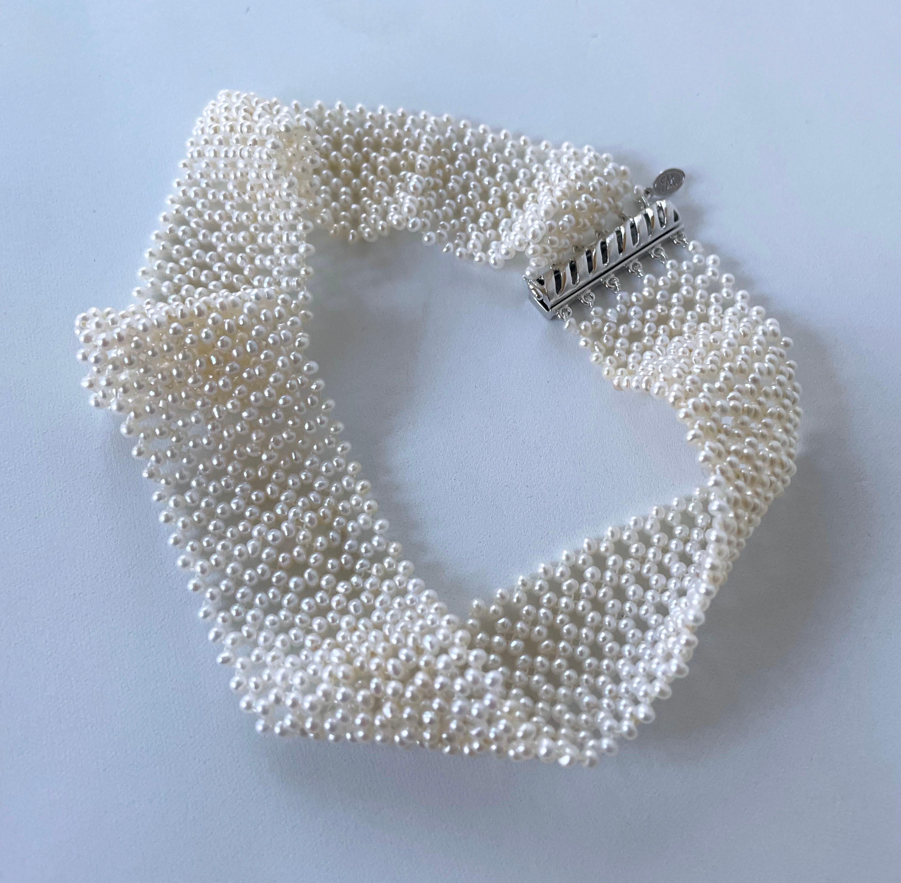 Absolutely stunning Choker by Marina J. This piece is made with all cultured white Seed Pearls intricately hand woven together into a fine Lace like design, inspired by old world jewelry. This piece is woven with a slight graduation, giving the