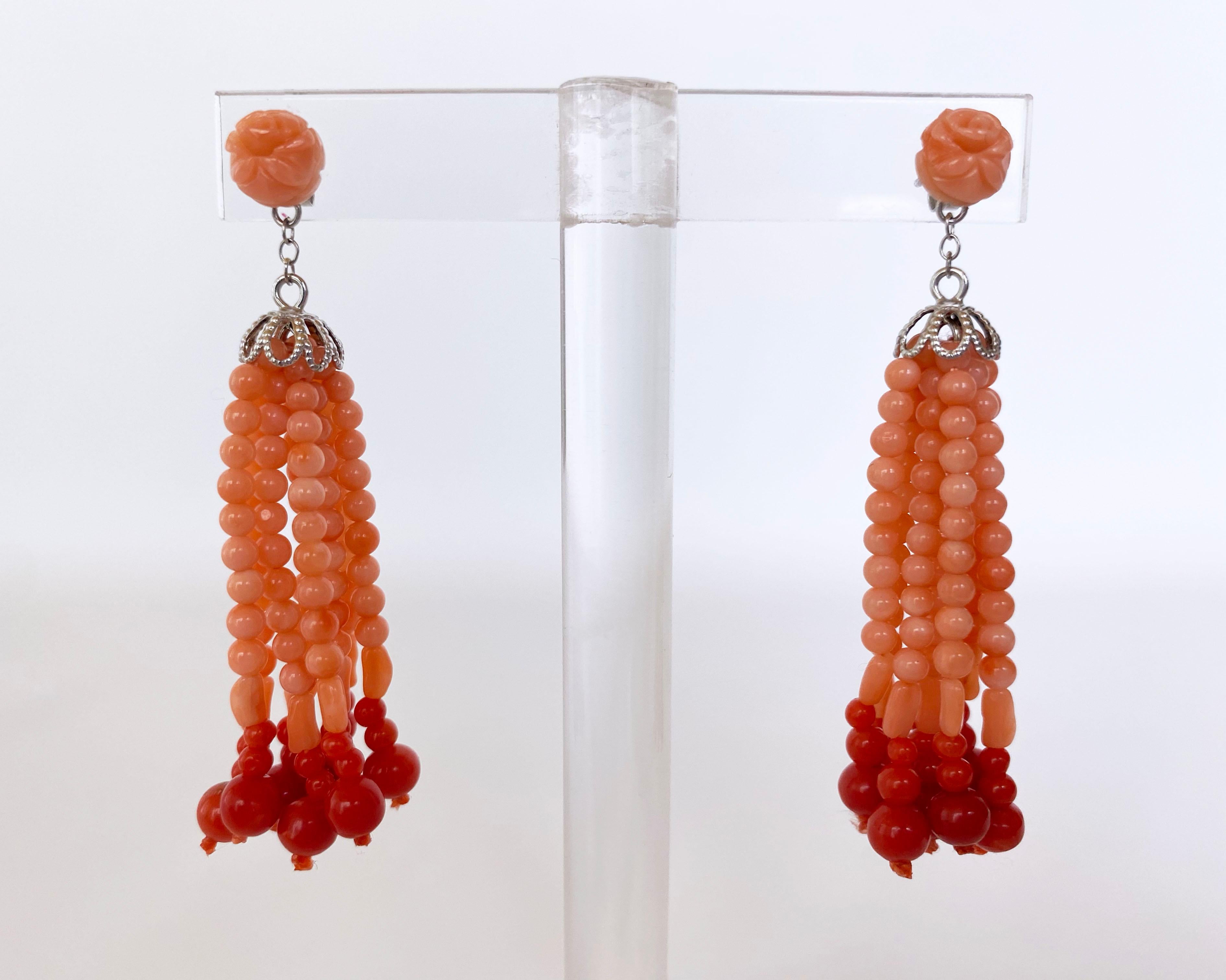 Beautiful and playful pair of earrings made by Marina J. This innocent pair is made of Mediterranean Coral beads displaying a gorgeous soft Pink/Orange hue, strung together with a slight graduation and accented by Red Mediterranean Coral. These