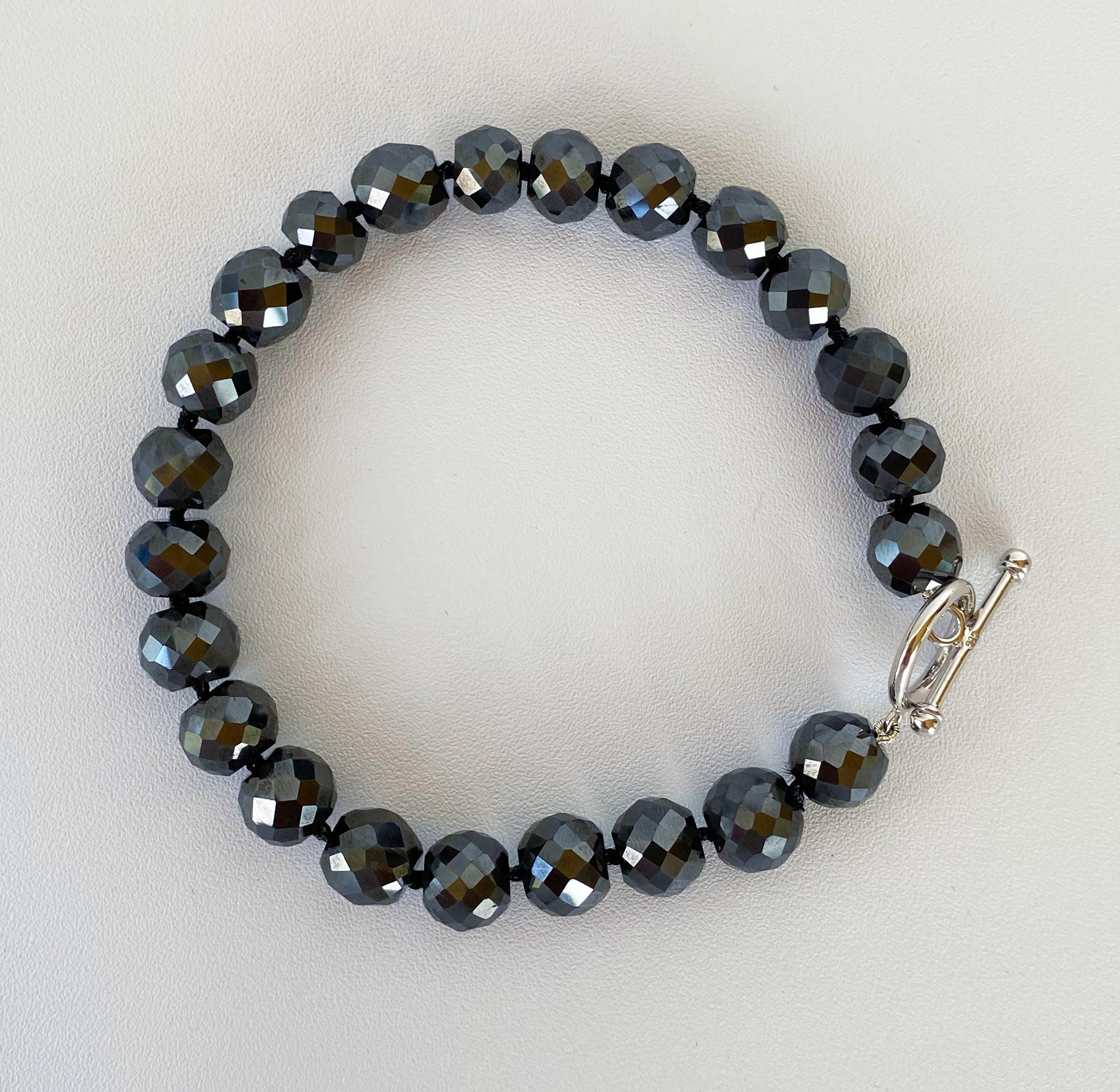 Simple yet bold, men's / unisex black spinel bead bracelet. This bracelet features a great spark due to multi cut beads and meets at a Rhodium Plated, Silver toggle clasp, ensuring a secure and durable hold. Measuring at 9 inches, this bracelet sits