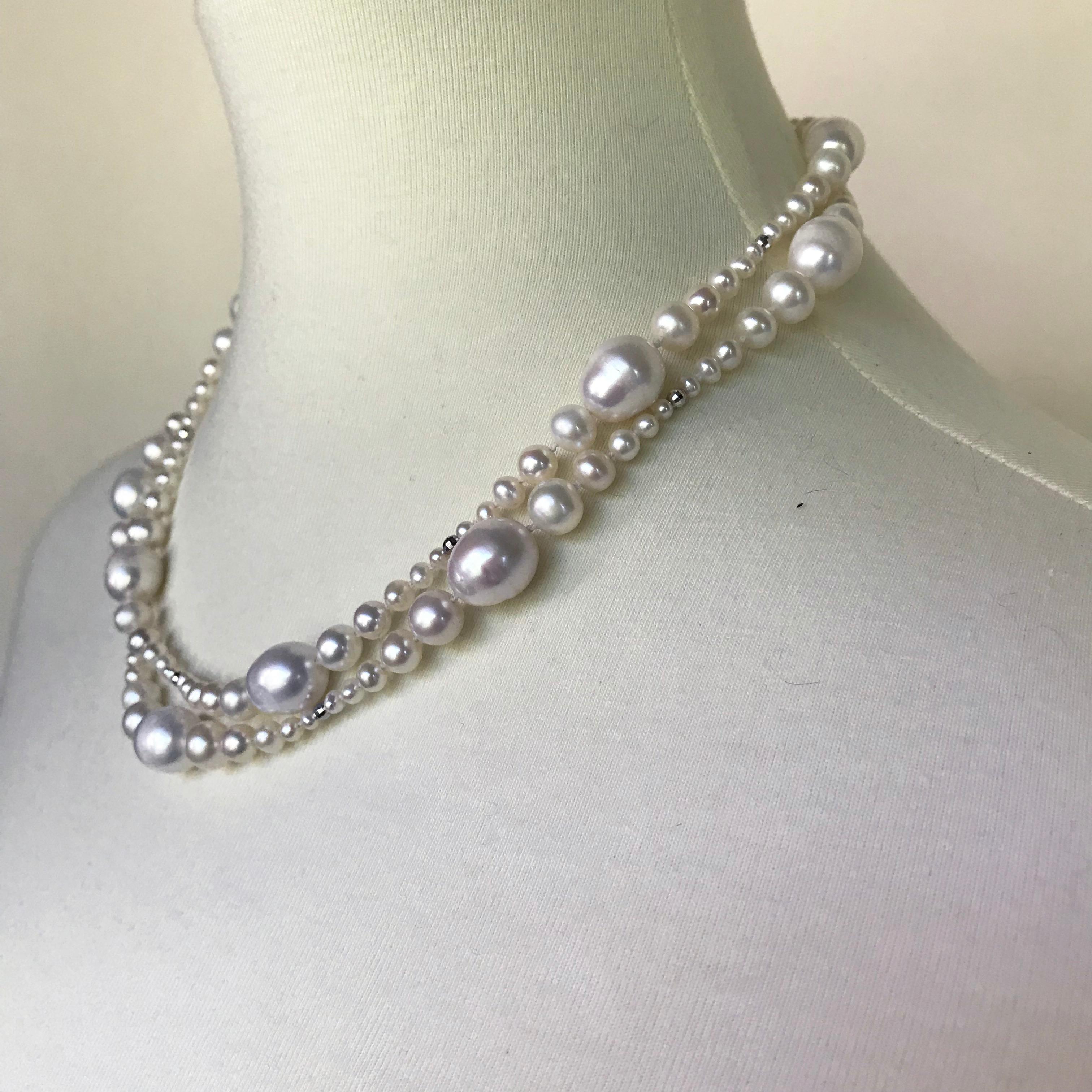 This unique multi-graduated white pearl necklace is composed of a long strand of graduated pearls (2 mm-9 mm) with white gold faceted beads and 14 k white gold clasp. The necklace is 36 inches in length and it allows to wear it in a single or a