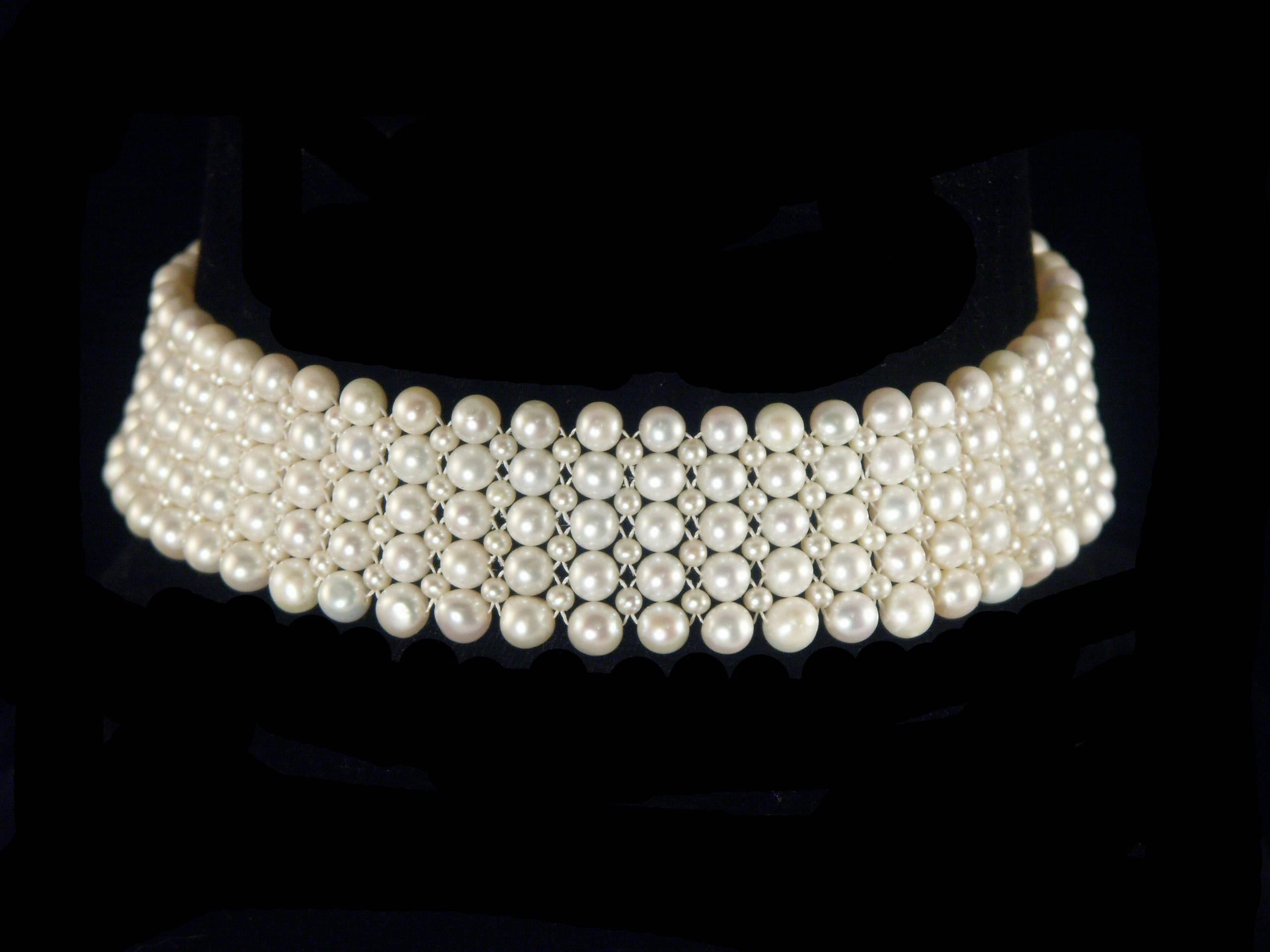 Beautiful and elegant piece by Marina J. This lovely Choker is made using 3mm and 6mm cultured Pearls all woven together into a fine lace like design. Measuring 13.5 inches long, this piece meets at a decorative White Gold plated Silver stamped