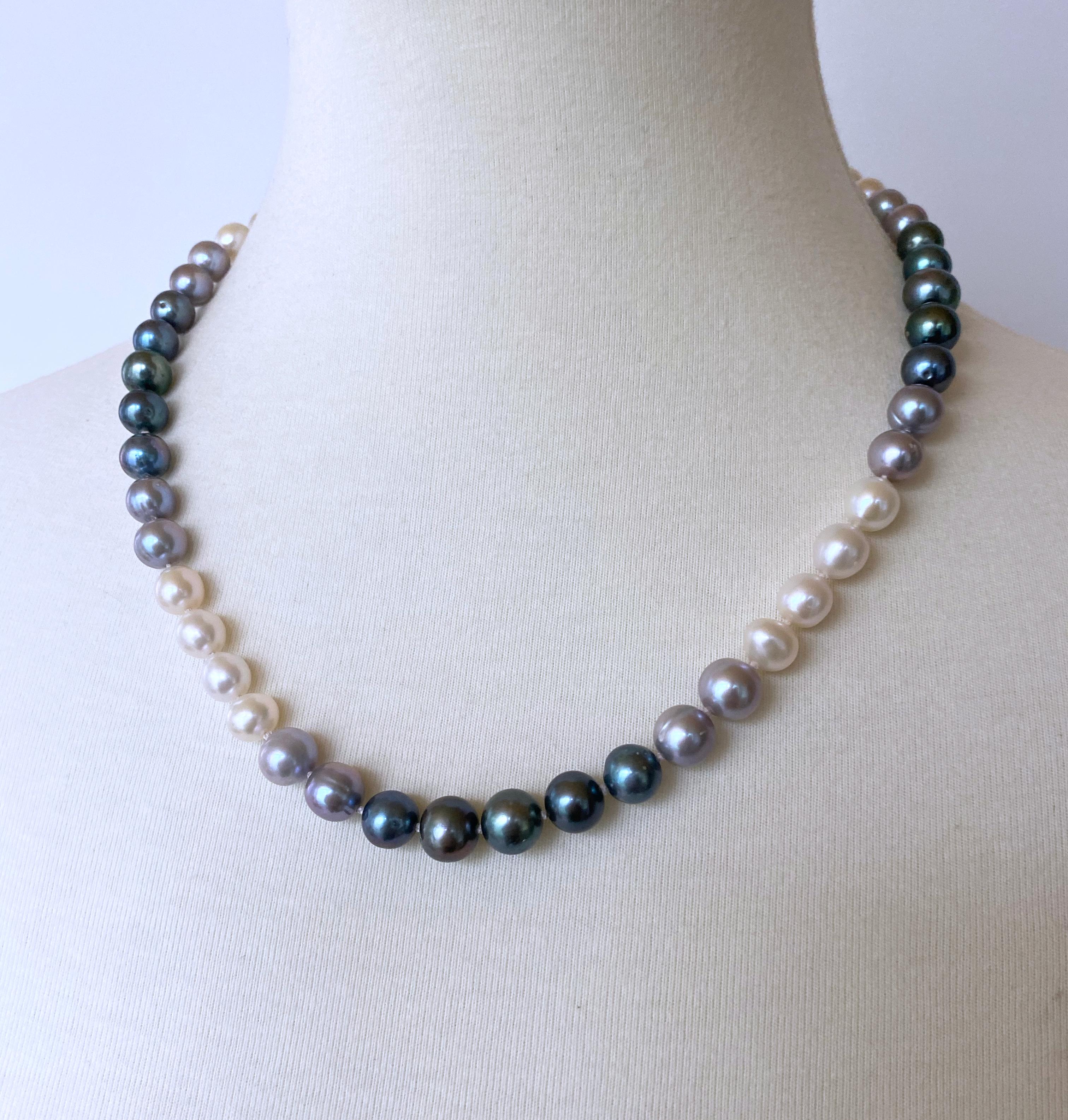Gorgeous knotted Pearl Ombre necklace by Marina J. This beautiful piece features all Cultured White, Grey and Black Pearls which display radiant iridescence. Measuring 20.25 inches long, this necklace meets at a solid 14k Yellow Gold Ball clasp,