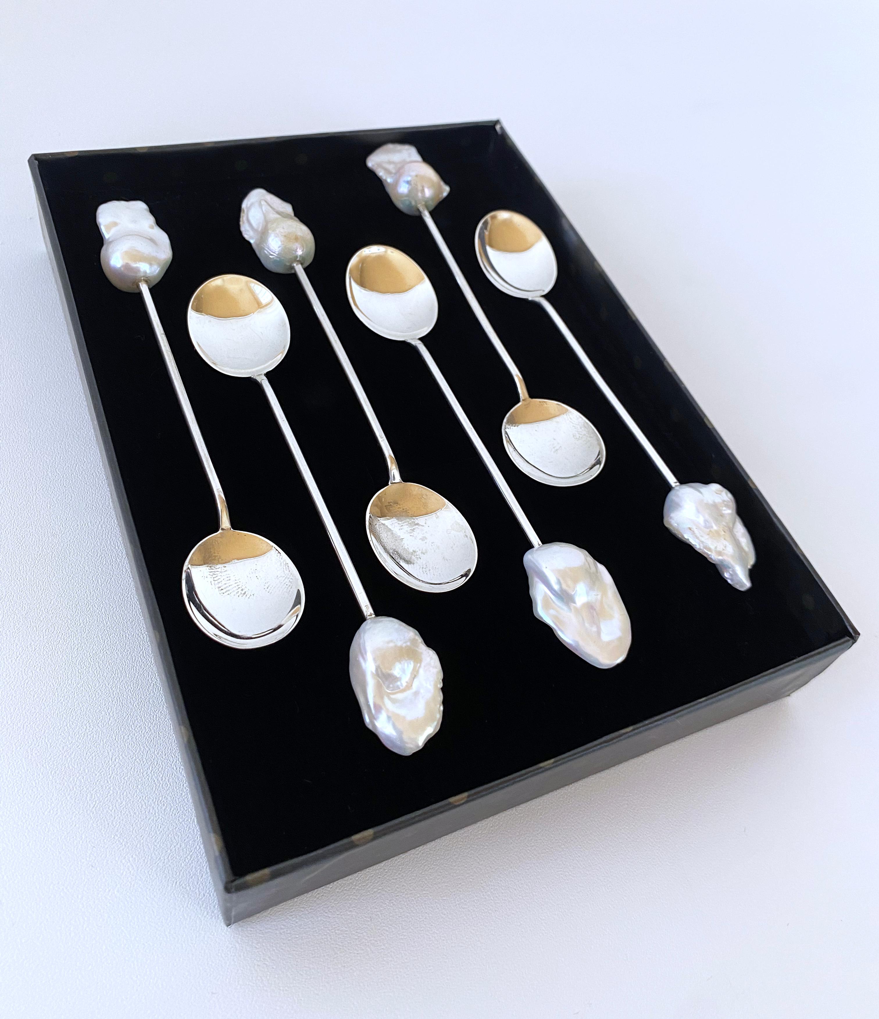 Ultimate One of A Kind Antique Spoon set from Marina J. This set of six spoons features Vintage Sterling Silver and are all stamped on the bottom. Measuring 4.5 inches each, gorgeous iridescent Baroque Pearls with vivid Luster adorn the ends of all