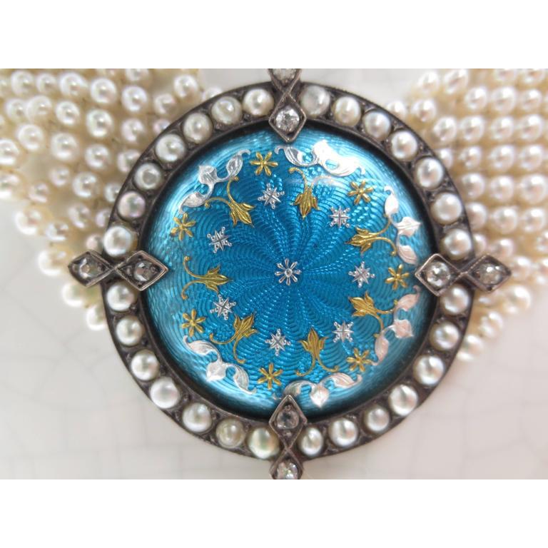 Gorgeous One of A Kind piece by Marina J.
This Necklace features a Vintage Blue Enamel Silver brooch with original Antique Pearls that is reworked into this stunning Centerpiece. A lovely round Teardrop Pearl hangs below the Centerpiece that is