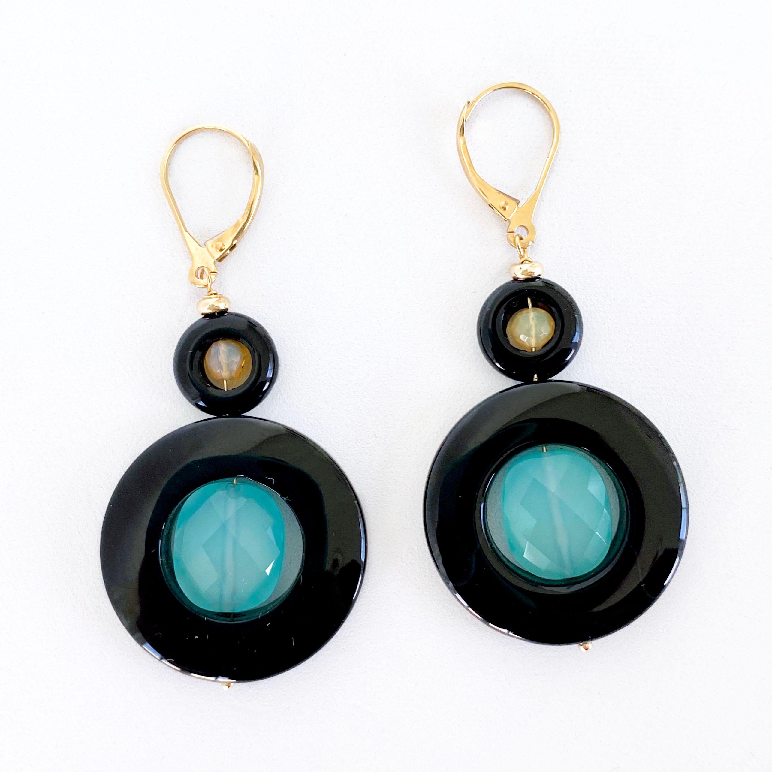 Beautiful and colorful pair of Earrings by Marina J.
This pair is made with Black Onyx 'donuts', Faceted Fire Opal, Faceted Blue Chalcedony and all Solid 14k Yellow Gold wiring, beads & Lever Back Hooks.

The Fire Opal encased within the Black Onyx
