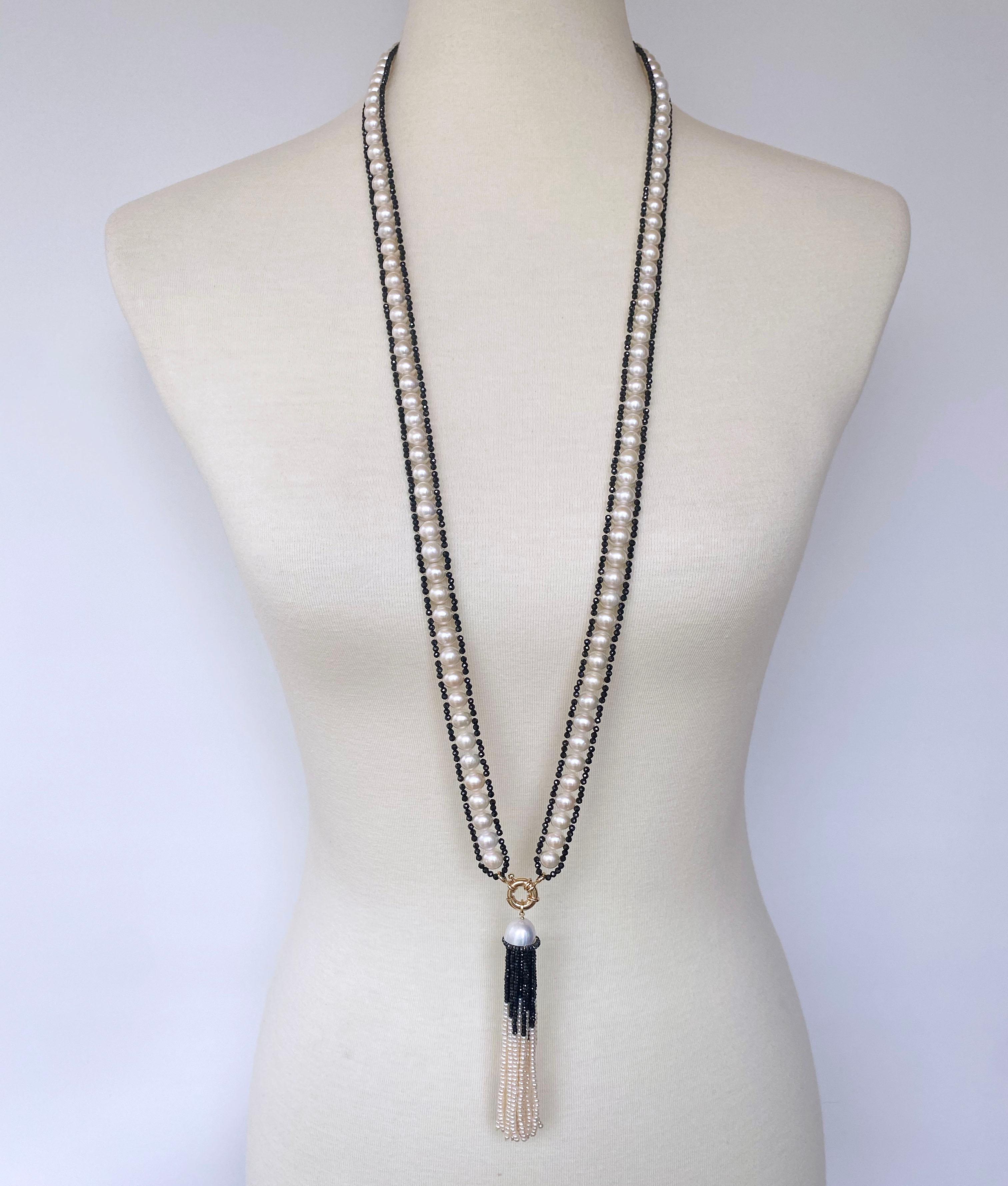 Beautiful Satuoir handmade by Marina J. in Los Angeles. This amazing piece features real White Pearls (8mm) which display a great iridescent sheen, woven together and adorned with faceted Black Spinel. Measuring 39 inches sans Tassel, this versitile