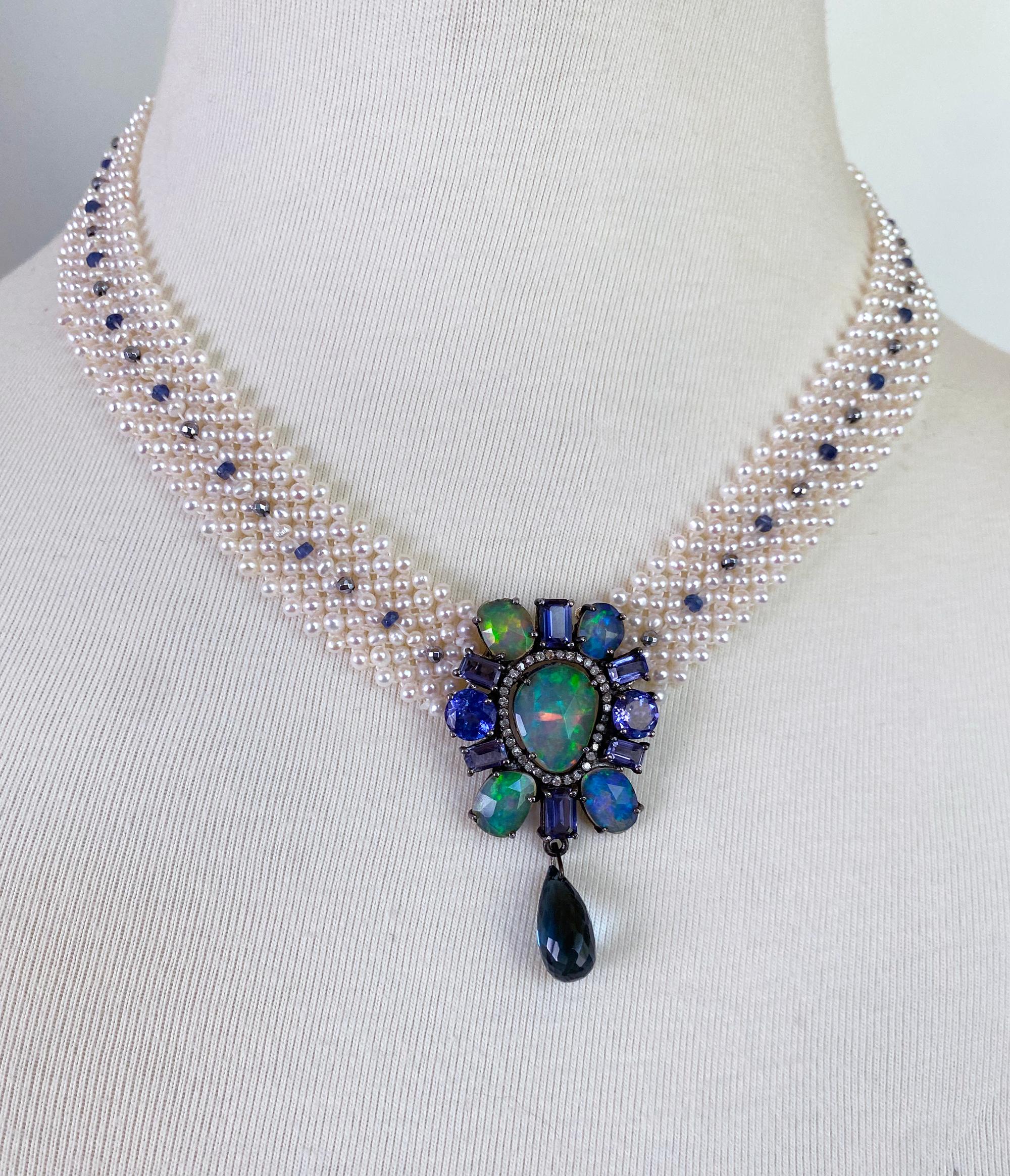 Beautiful One of A Kind piece by Marina J. This Necklace is made of all cultured Seed Pearls intricately woven together into an elegant Lace like design. Faceted Blue Sapphires and Hematites adorn the center of the Pearl band, perfectly