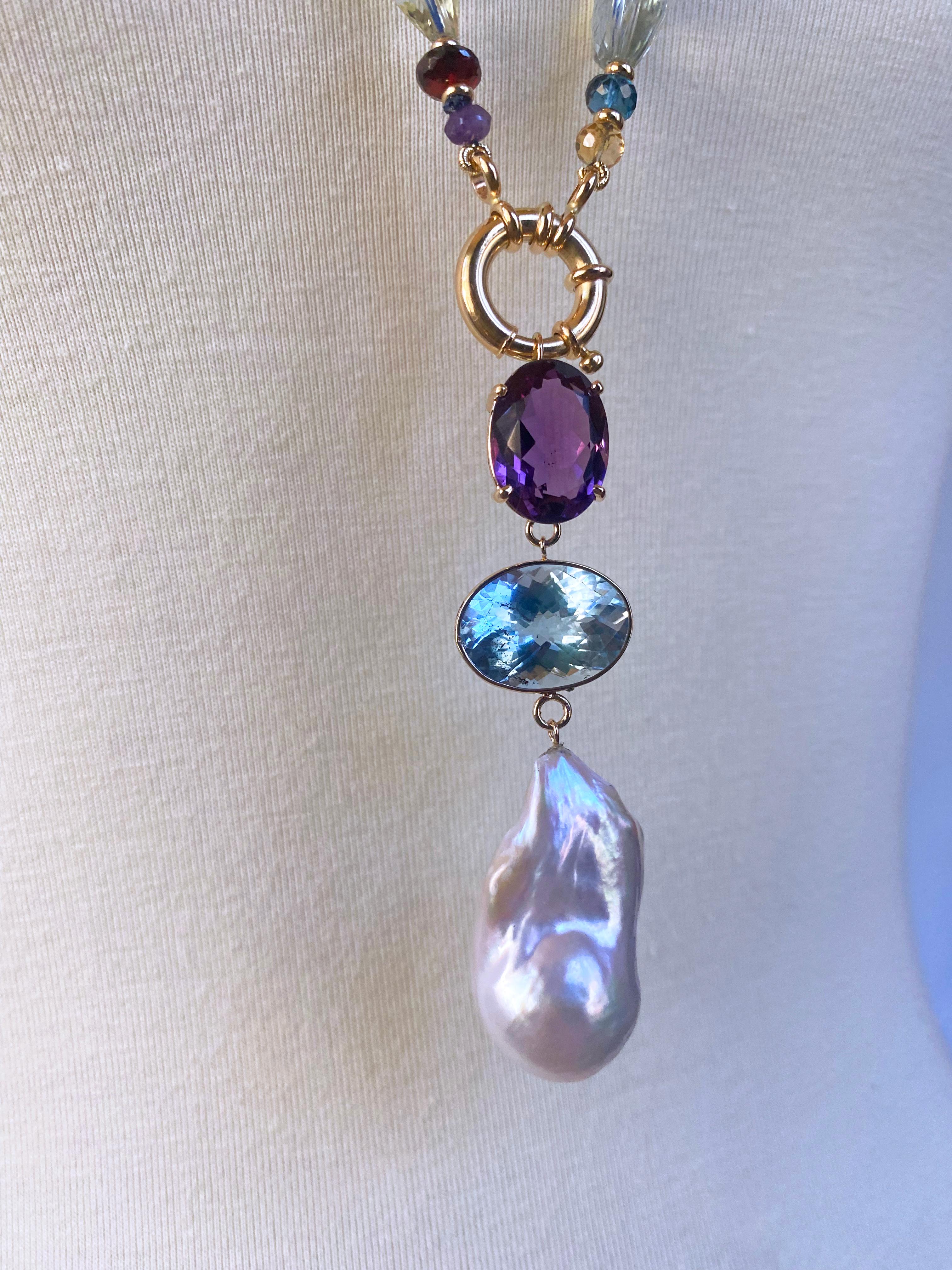 Stunning piece handmade by Marina J. This Necklace features faceted multi colored and multi shaped Semi Precious Gems all strung together into a beautiful One of A Kind piece. Brilliant Aquamarine, London Blue Topaz, Amethyst, Citrine, Kyanite,