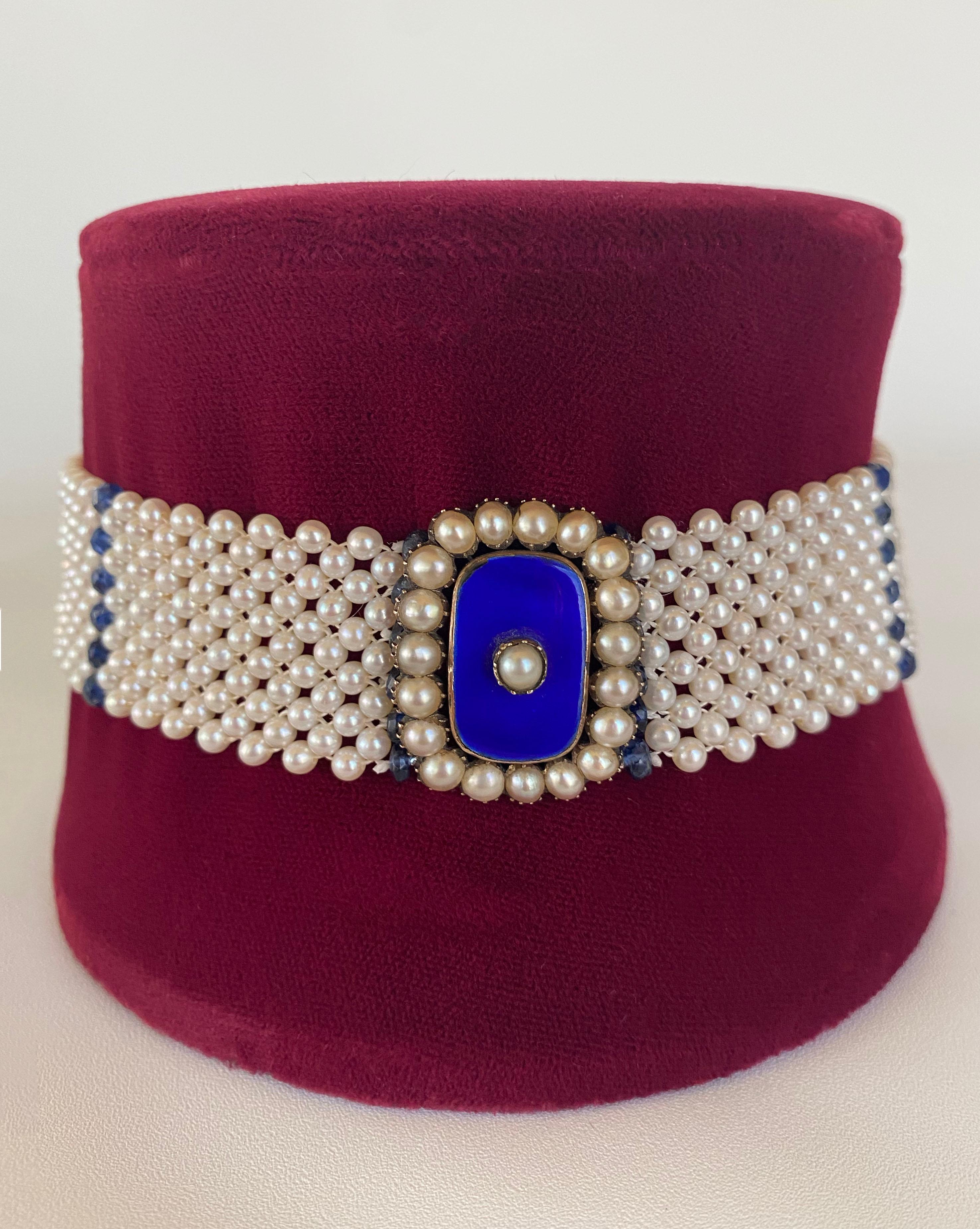 Gorgeous Vintage 1920s Enamel Centerpiece with original Natural Pearls reimagined into a stunning Choker. The centerpiece radiates a vibrant Royal Blue color that cannot be missed, complimented by high luster white Pearls which display a beautiful