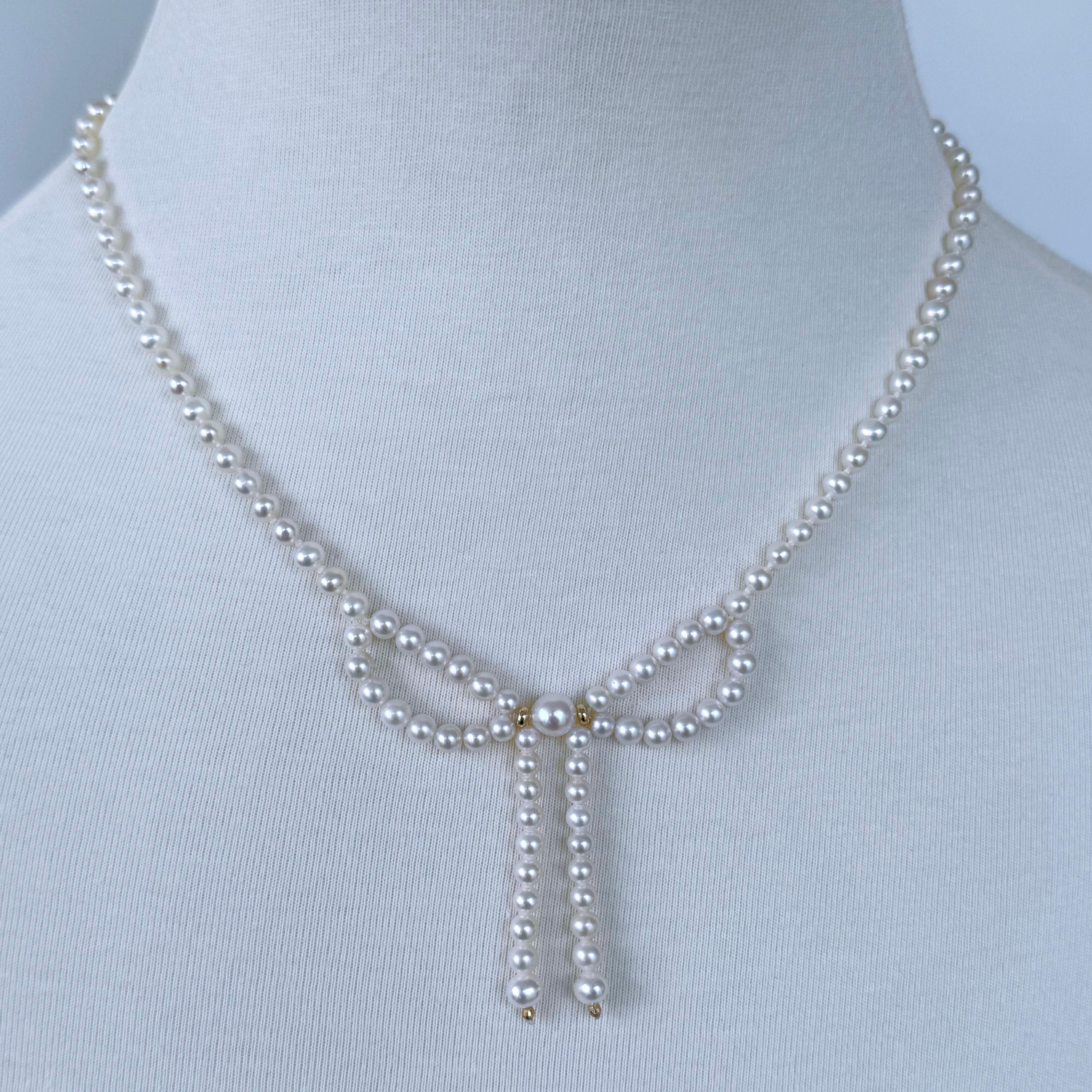 Beautiful Bow Necklace by Marina J.

This Necklace is made entirely of Pearls and Solid 14k Yellow Gold. The Centerpiece displays a simple yet gorgeous Pearl Bow with two Solid 14k accents that is bordered by elegant Pearl strung band that meet at a