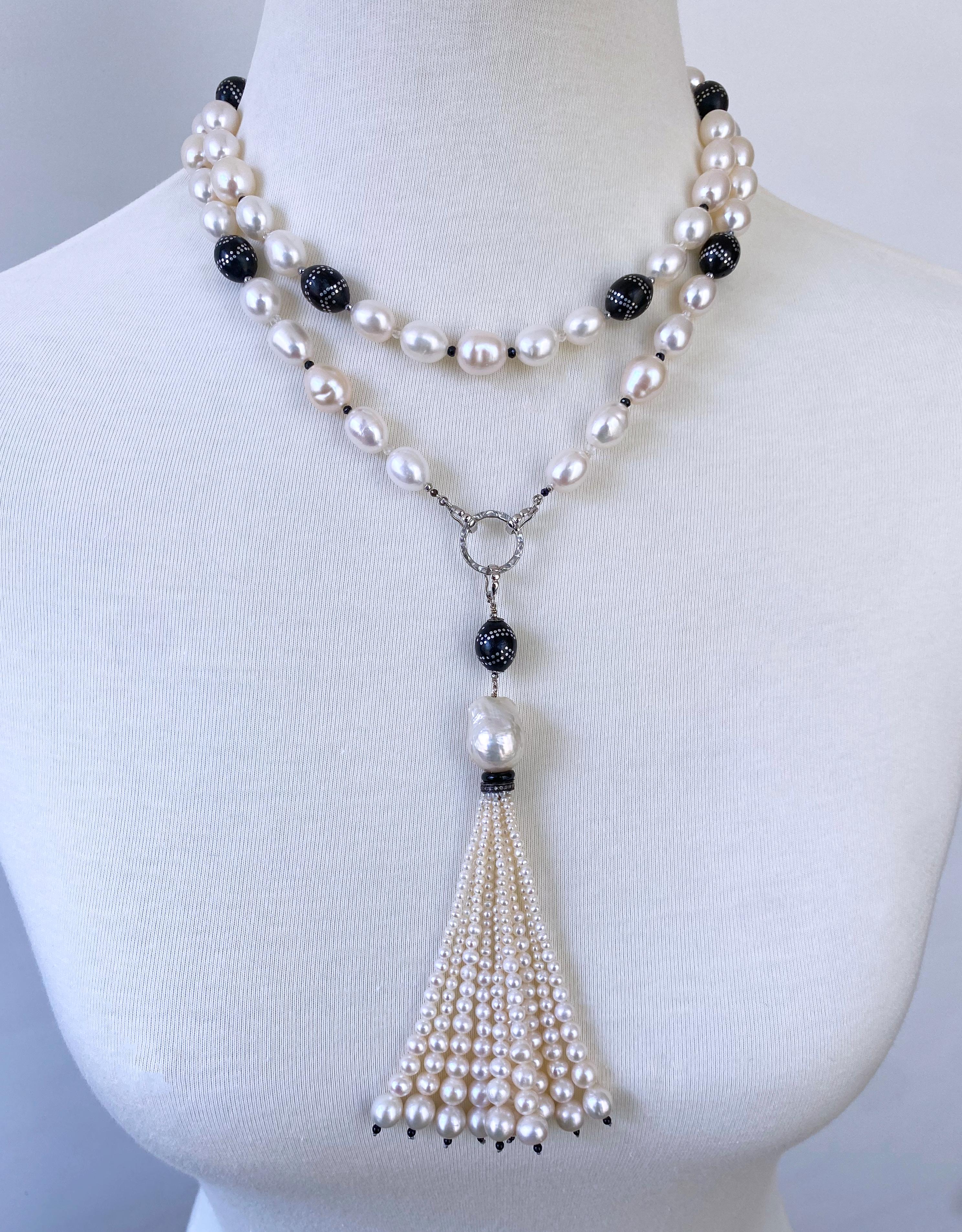 Beautiful Sautoir by Marina J.

This piece is made with all Baroque white Pearls displaying a soft iridescent luster, strung together with vintage Black & Silver vintage 