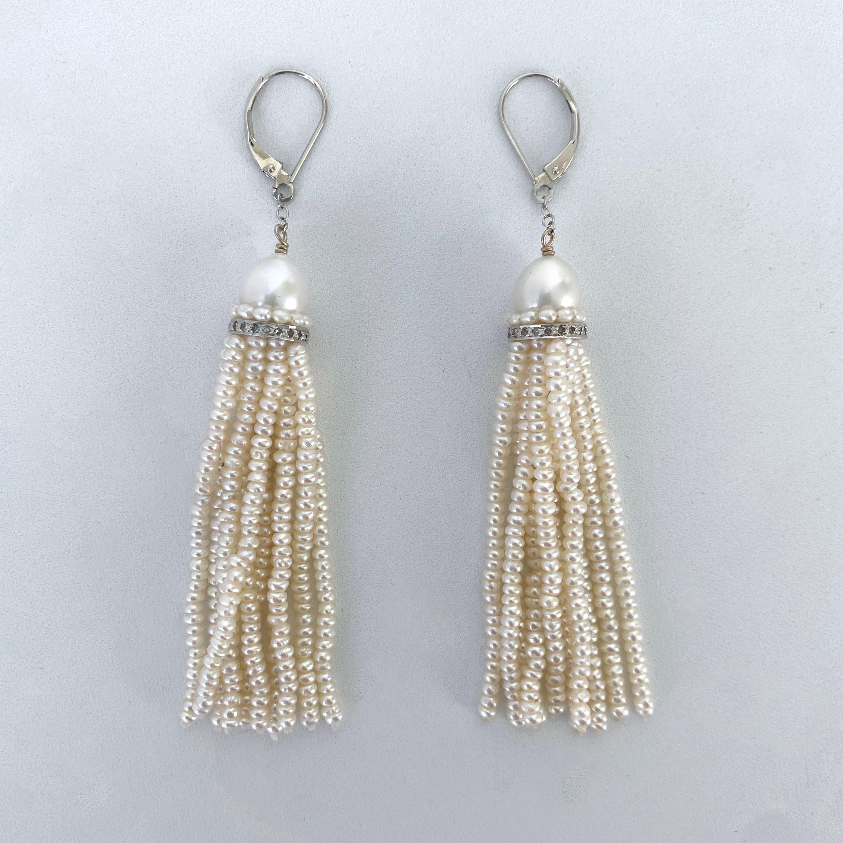 Simply, classic and elegant pair of Earrings by Marina J.

This lovely pair is made with all multi sized Pearls, Rhodium Plated Silver and Diamonds. A Almond shaped Pearl sits atop a Pearl band and Diamond encrusted - Rhodium plated Silver roundel,