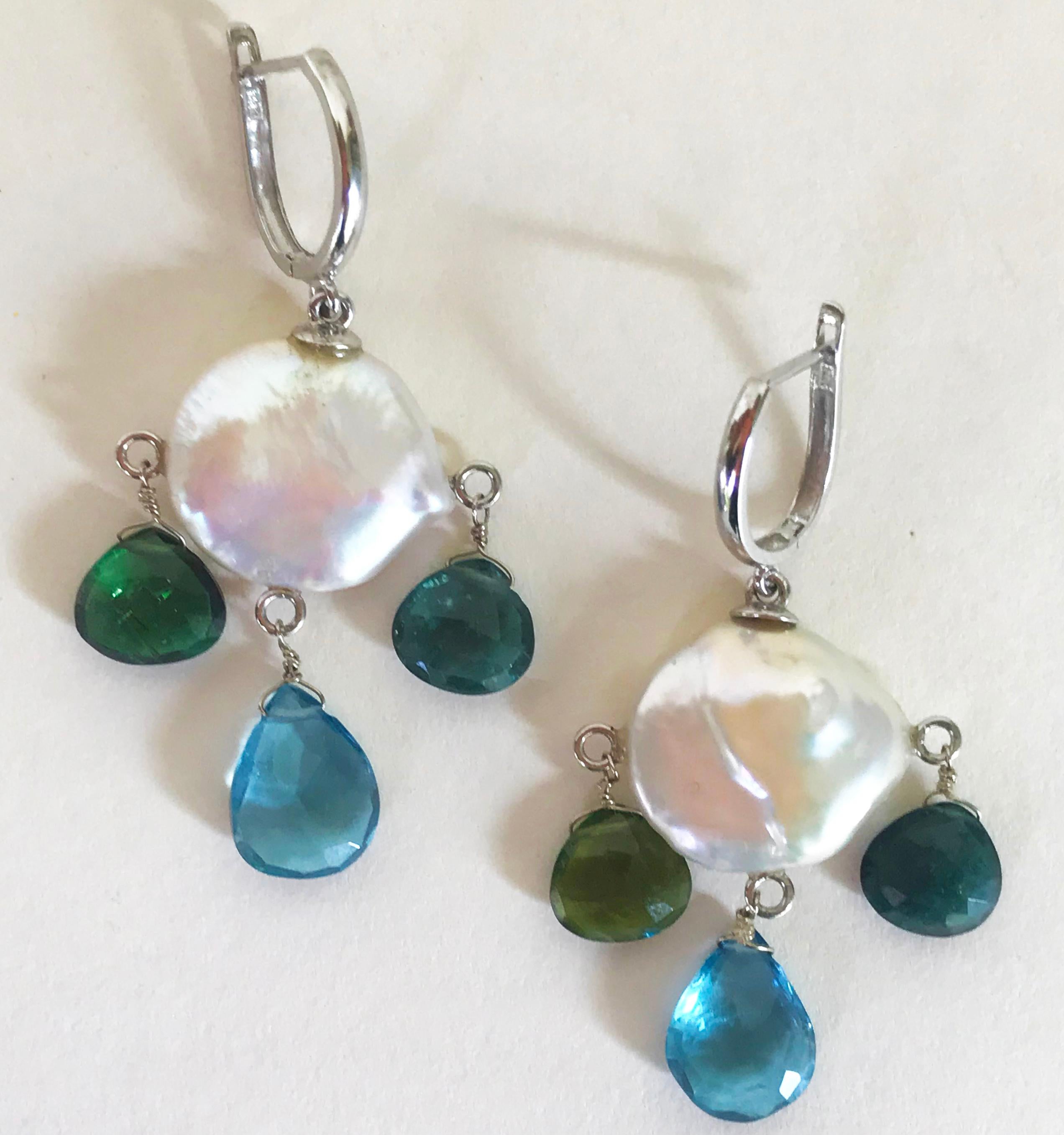 Marina J presents these fun but yet classical coin white pearls, green tourmaline briolettes, and London blue topaz beads with 14k white gold wiring and lever backs. Inspired by an ocean-themed color pallet, these elegant yet whimsical earrings are