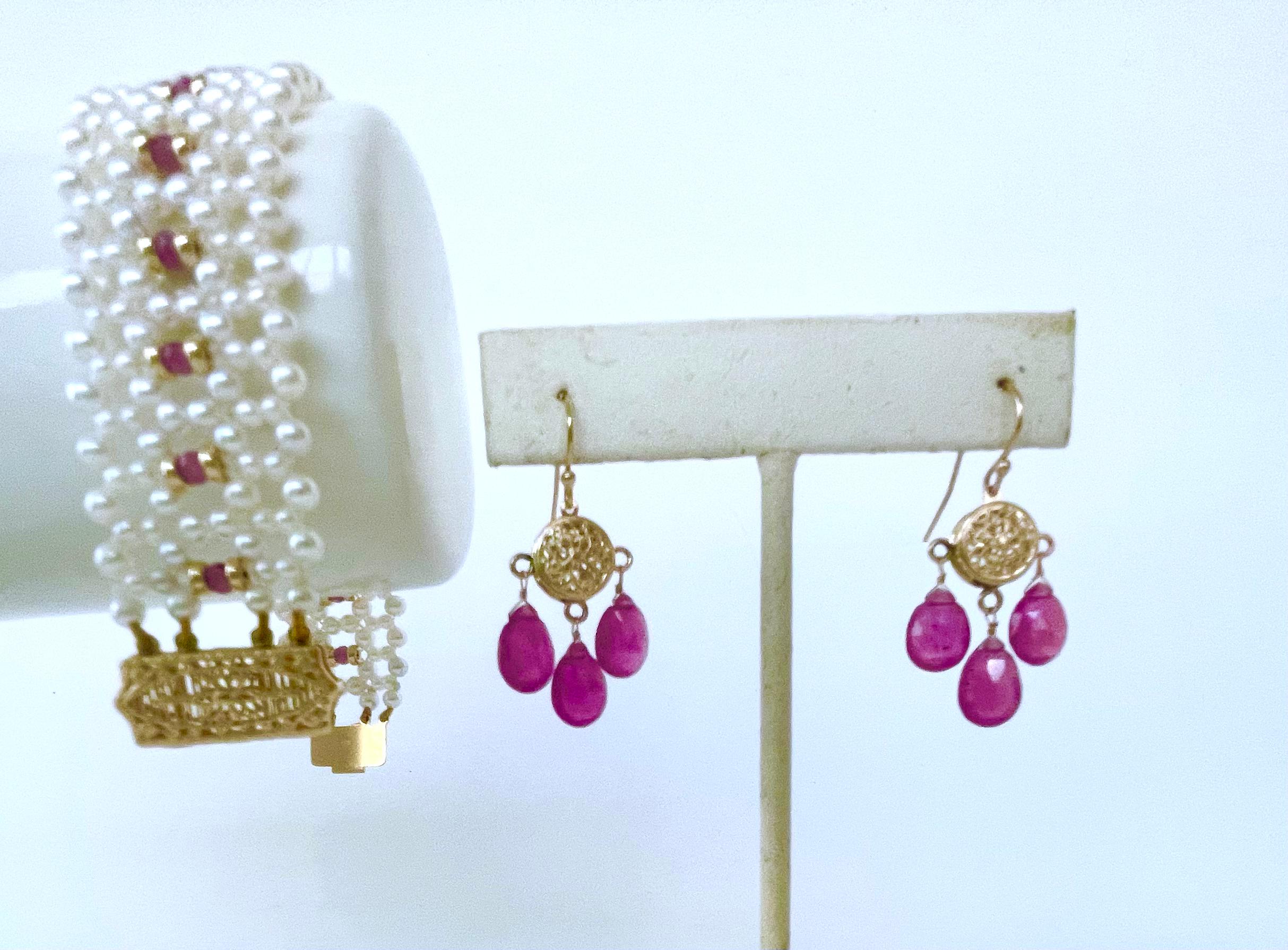 Beautiful pair of Earrings by Marina J.
This pair is made with all solid 14k Yellow Gold wiring and findings. A circular solid 14k Yellow Gold filigree Finding is used as a Centerpiece, from which stunning faceted Teardrop shaped Pink Sapphires that