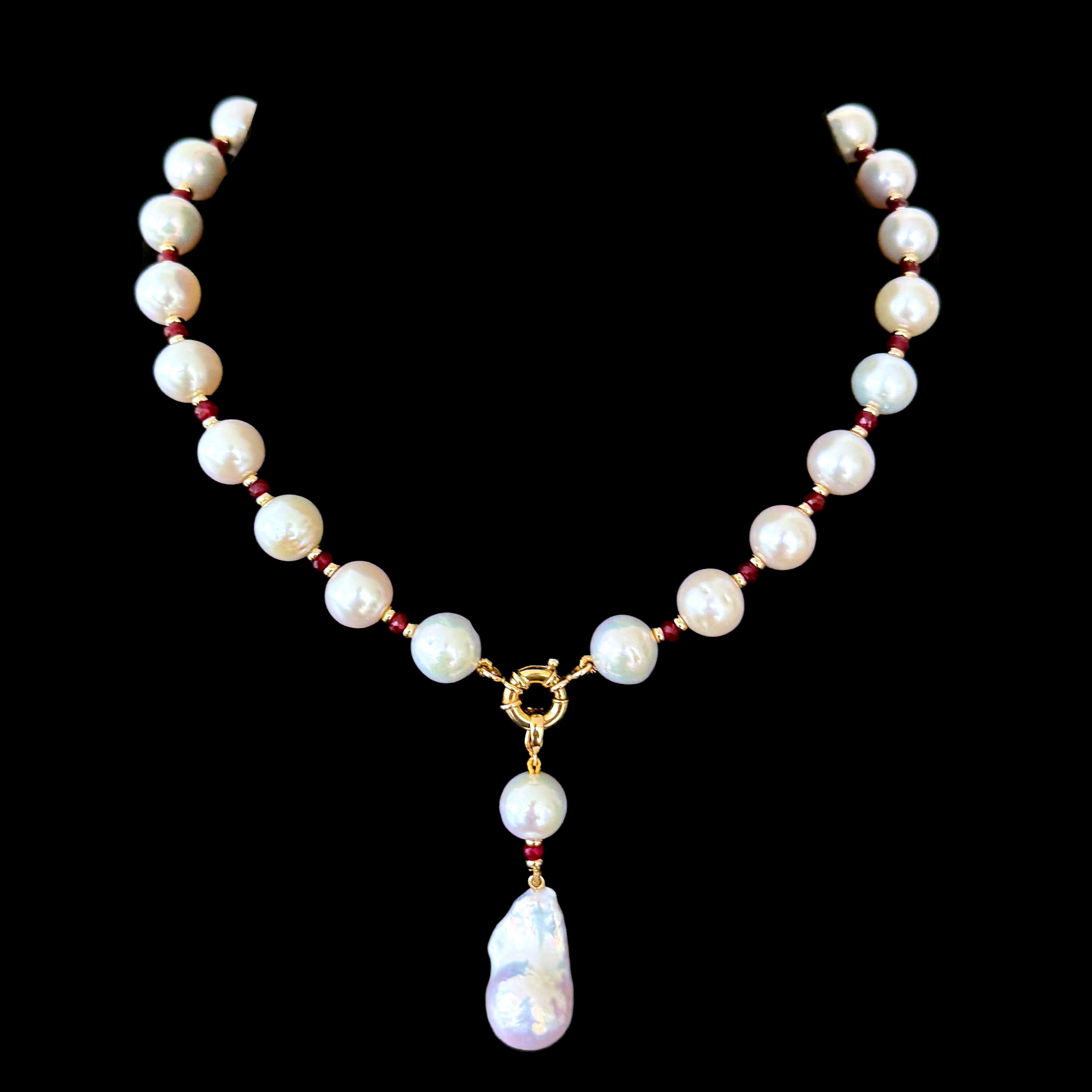 Beautiful and dramatic Necklace by Marina J. 
This Statement piece is made using high luster Pearls, all displaying a soft iridescence. The Pearls in this Necklace slightly Graduate and are perfectly adorned by Faceted Rubies and Solid 14k Yellow