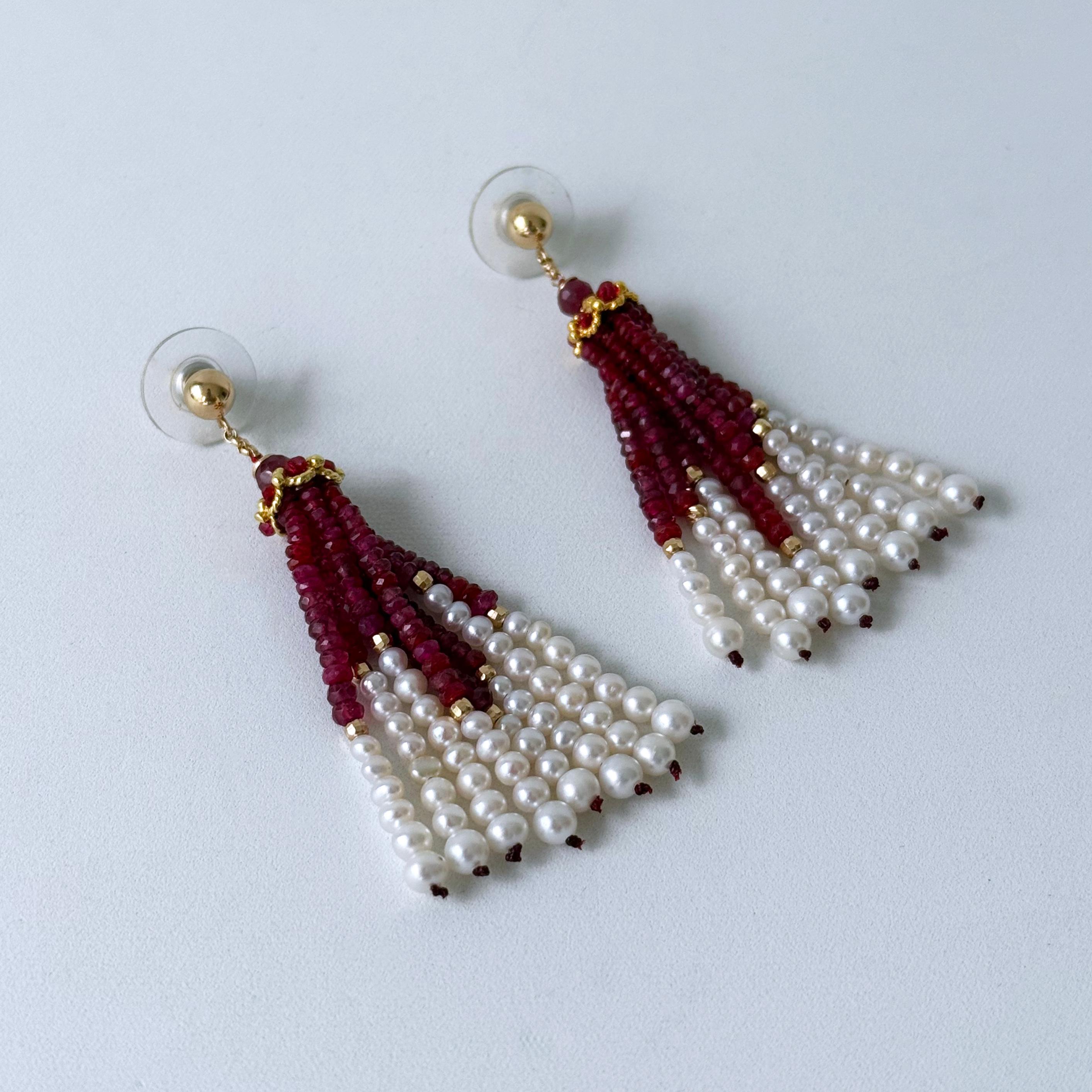 Gorgeous pair of Tassel Earrings by Marina J. A beautiful round Solid14k Yellow Gold Stud starts this piece, from which a decorated Solid 14k Yellow Gold Cup decorated with Rubies hangs from Solid 14k Yellow Gold chain. Graduated strands of faceted