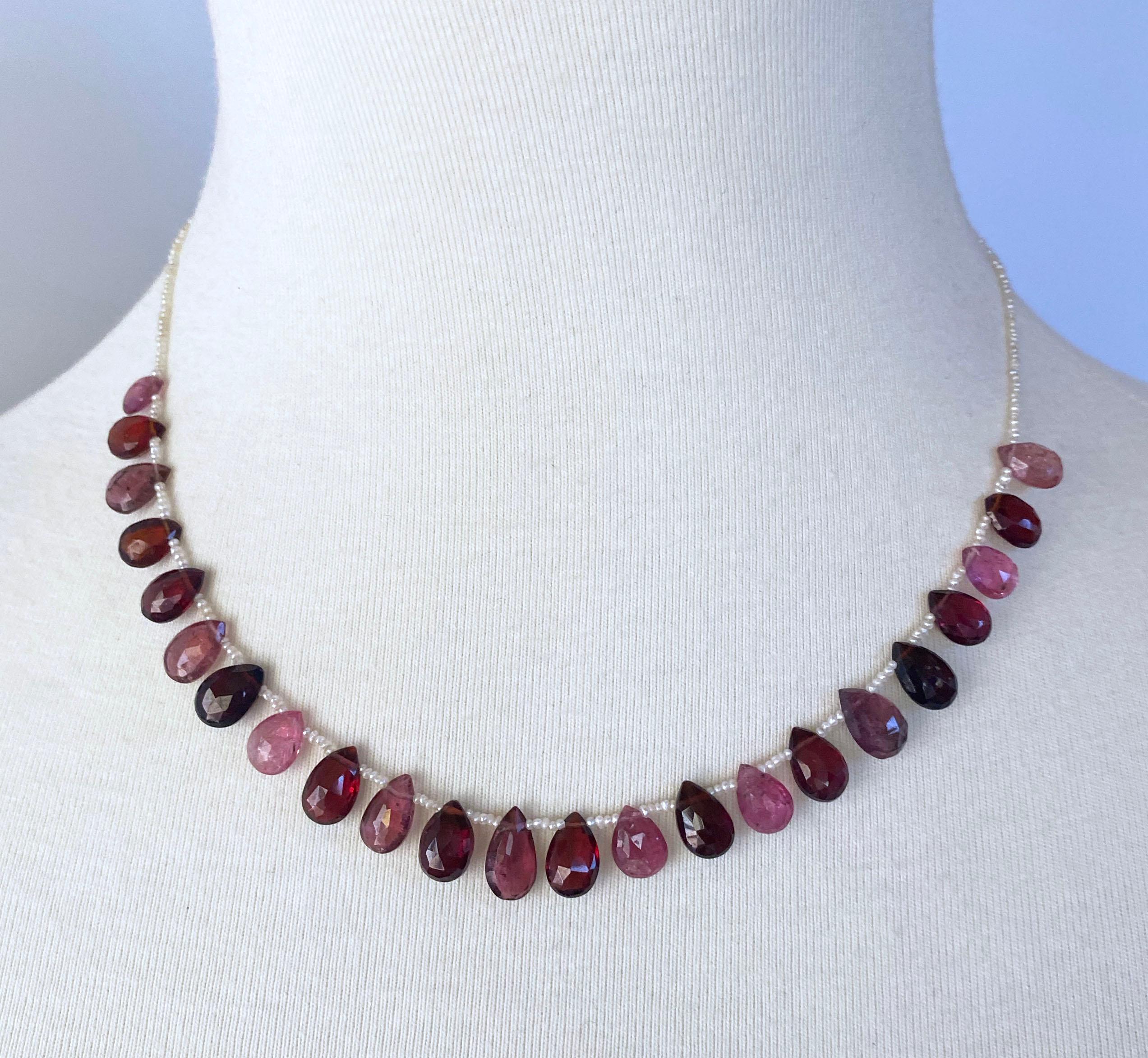 Simple yet bold necklace by Marina J. Made with Natural Seed Pearls adorned by stunning multi colored Pink and Red Tourmaline and Garnet Briolettes. These amazing stones illuminate and radiate gorgeous hues of fuchsia, pink and red when hit with