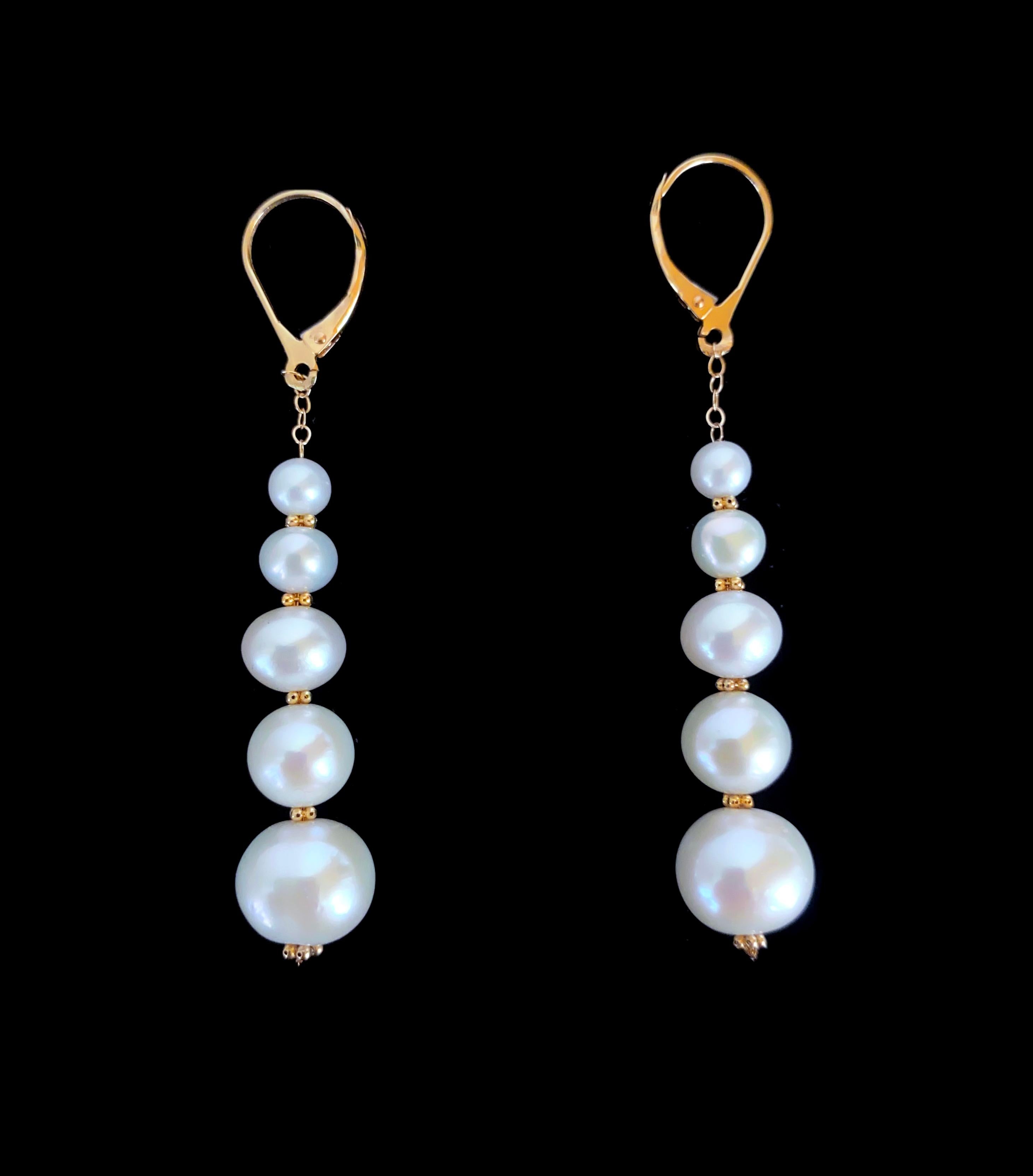 Beautiful pair of Earrings by Marina J. This pair is made with all solid 14k Yellow Gold Wiring and Chain.  Five cultured white Pearls with a soft iridescent luster perfectly complimented by the gold, hang off a solid 14k Yellow Gold chain. The