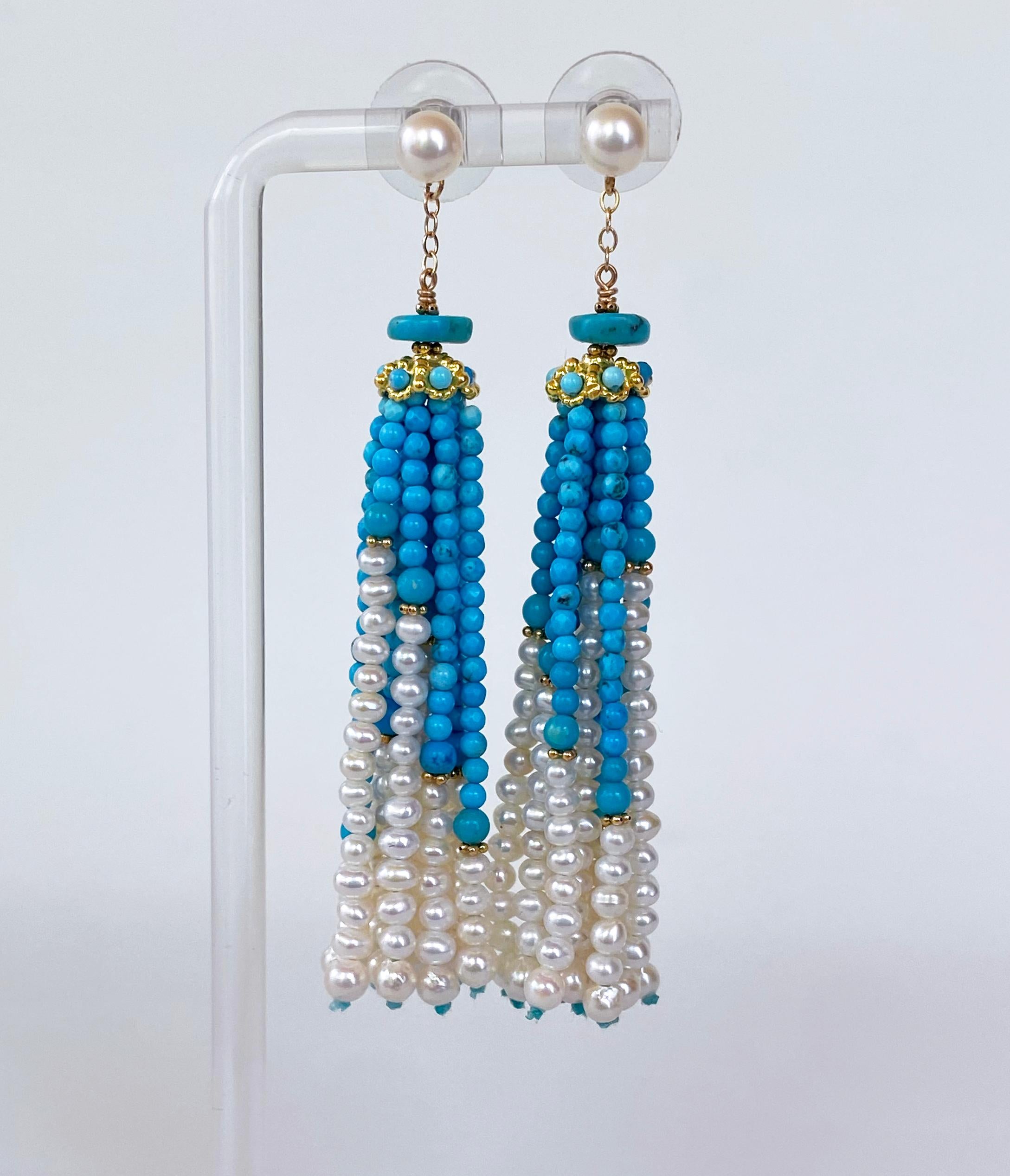 Gorgeous pair of earrings by Marina J featuring her classic Graduated Tassel Earring design. A solid 14k Yellow Gold chain hangs off a 5mm Studded Cultured Pearl. The chain attaches to a Turquoise roundel sitting atop a solid 14k Yellow Gold