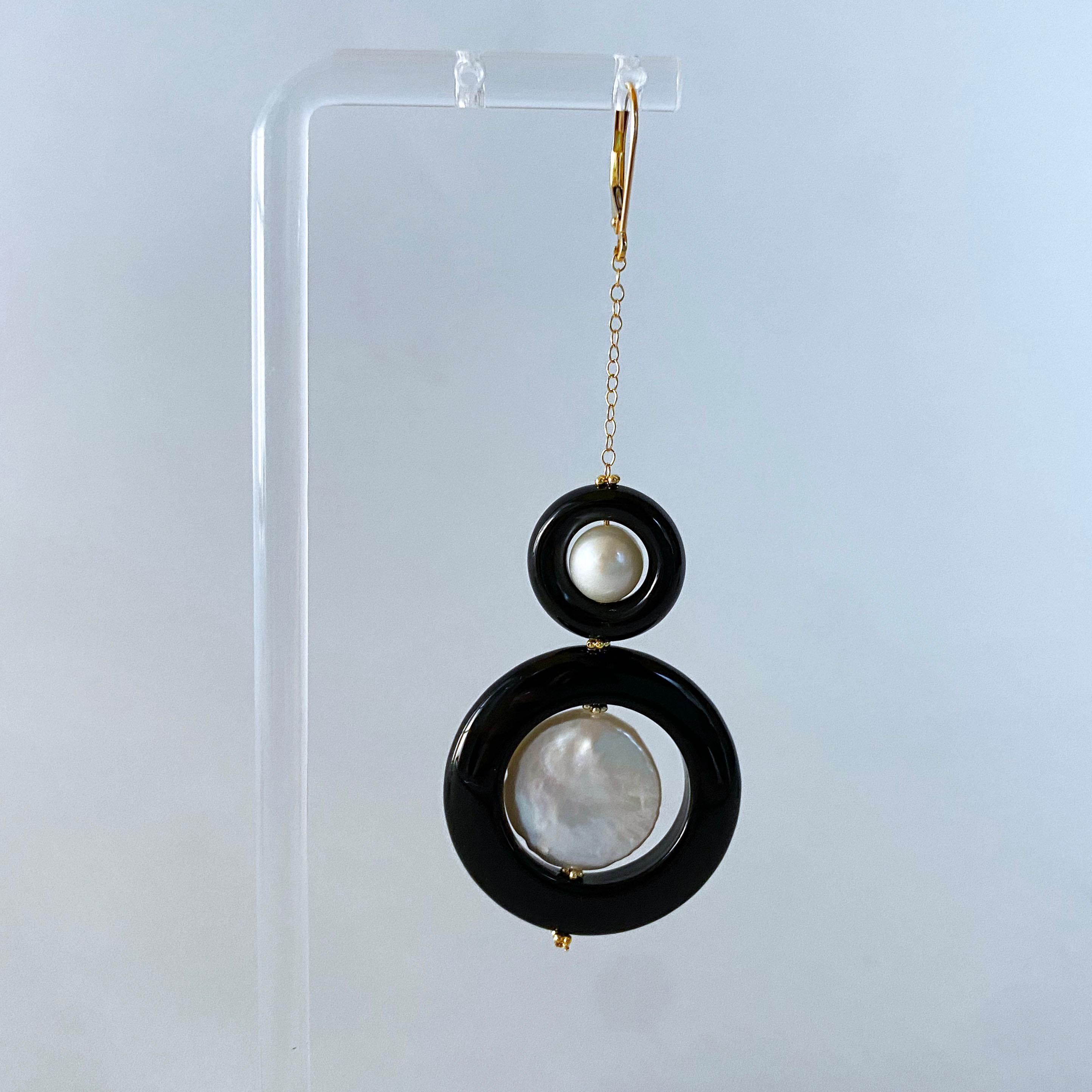 Classic pair of Earrings by Marina J. This pair is made of all Solid 14k Yellow Gold wiring, chain and Lever Back Hooks. A Graudated set of Pearl sitting in Black Onyx  hang off solid 14k Yellow Gold chain which attaches itself to a solid 14k Yellow