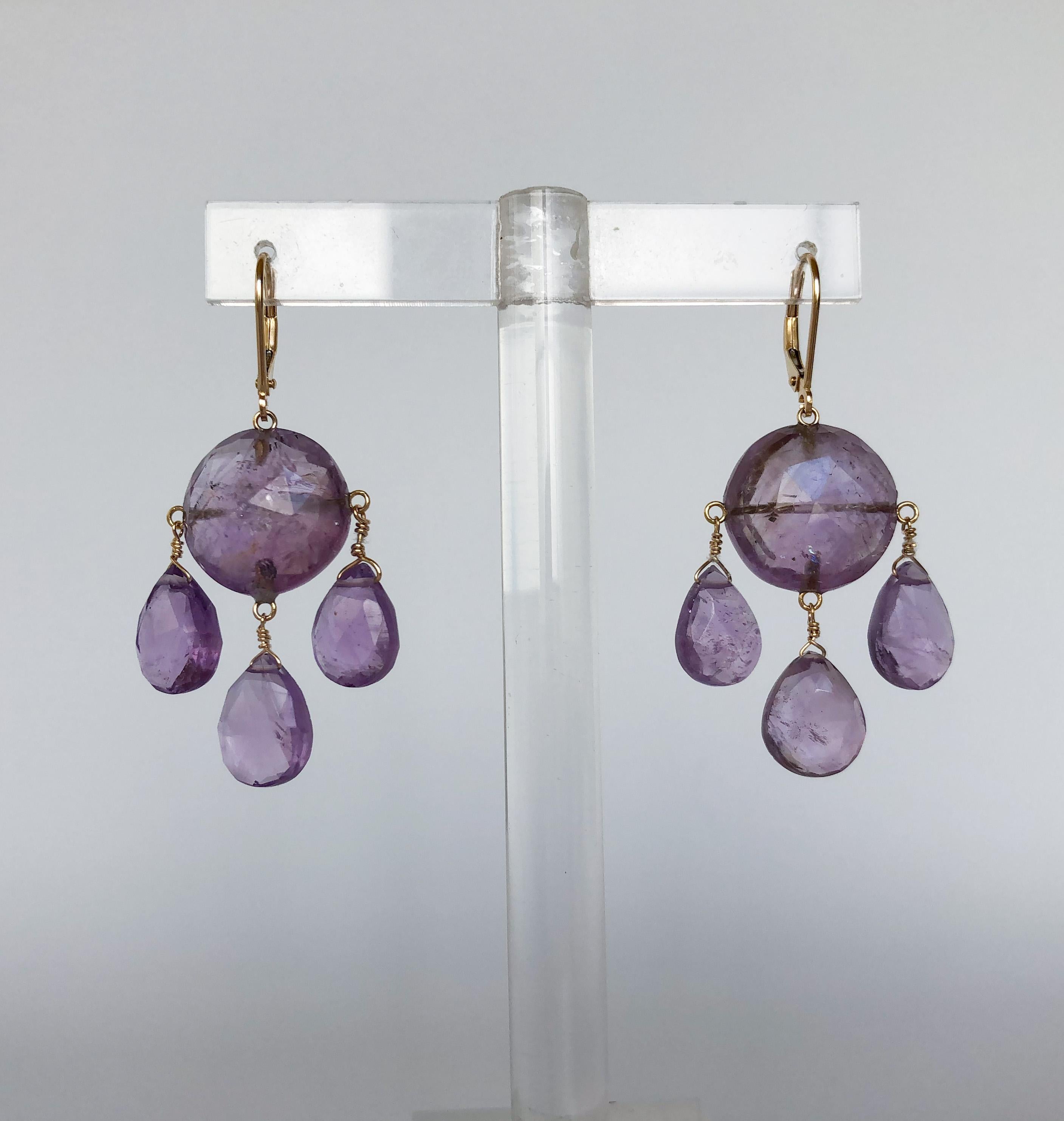 These elegant earrings are made with a 15 mm amethyst stone and three 10 mm amethyst teardrop beads. The earrings are sturdily secured with 14k yellow gold wiring and lever-backs. The earrings are about 1.75 inches long, which hang beautifully for
