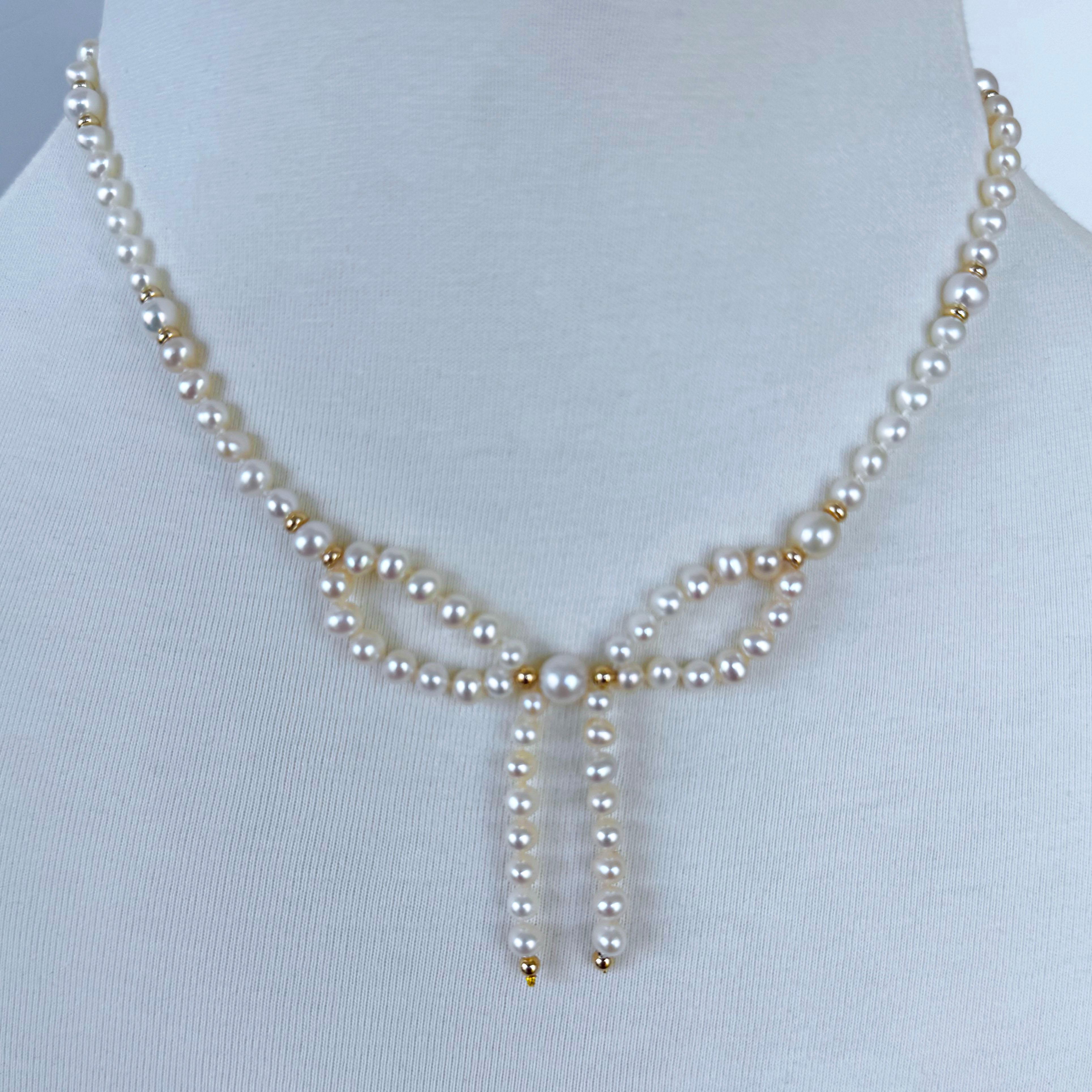 Beautiful Bow Necklace by Marina J.

This Necklace is made entirely of Pearls and Solid 14k Yellow Gold. The Centerpiece displays a simple yet gorgeous Pearl Bow with Solid 14k accents that is bordered by an elegant and slightly Graduated Pearl