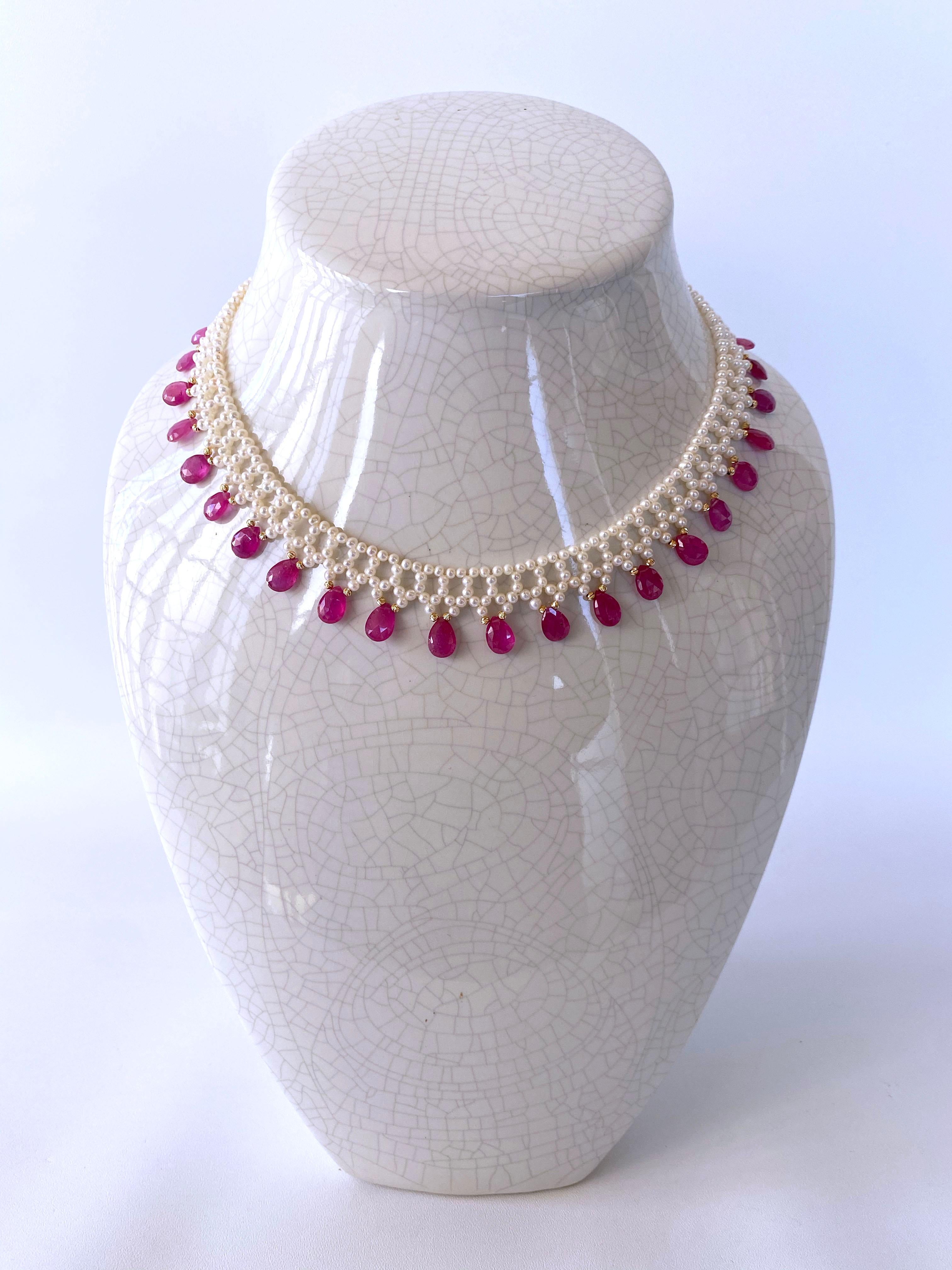 Gorgeous hand woven Pearl necklace by Marina J. This lovely piece features beautiful high luster White Pearls that have a wonderful iridescent shine woven into a fine lace like design. Gorgeous translucent Pink Sapphire briolettes adorn this
