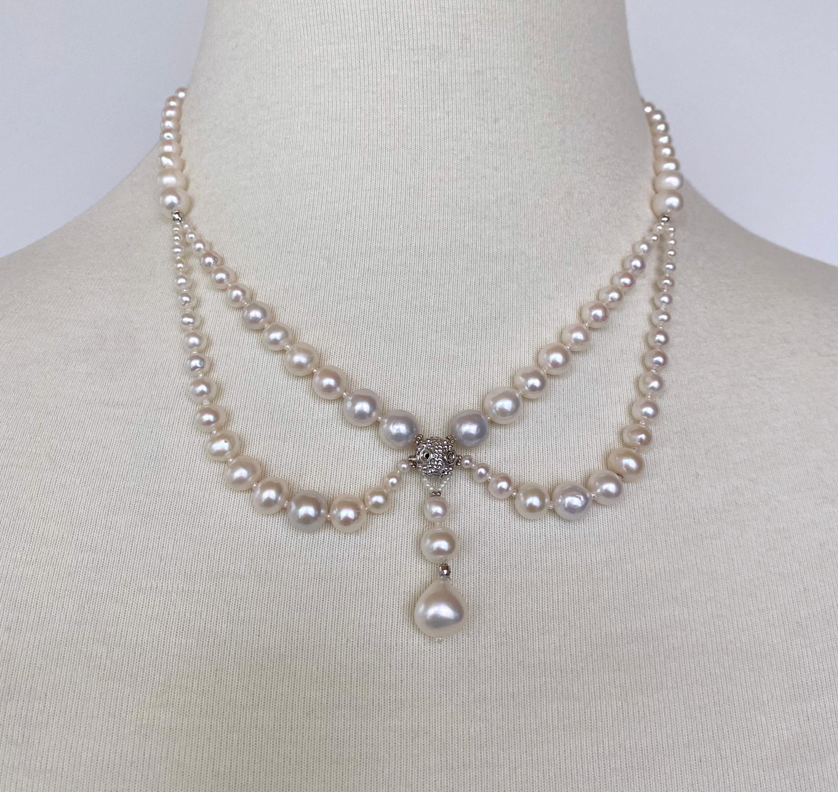 Gorgeous Victorian inspired Necklace by Marina J. This lovely piece features a Rhodium plated Silver decorative Filigree Bead which sits as the Centerpiece. Strands of Graduated Pearls are draped around it, giving a vintage regal and innocent feel