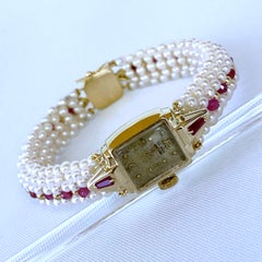 Marina J. Orologio vintage in oro giallo 14k con fascia di perle intrecciate e rubini e chiusura in oro
