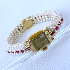 Montre vintage Marina J. en or jaune 14 carats avec perle tissée, bracelet en rubis et fermoir en or