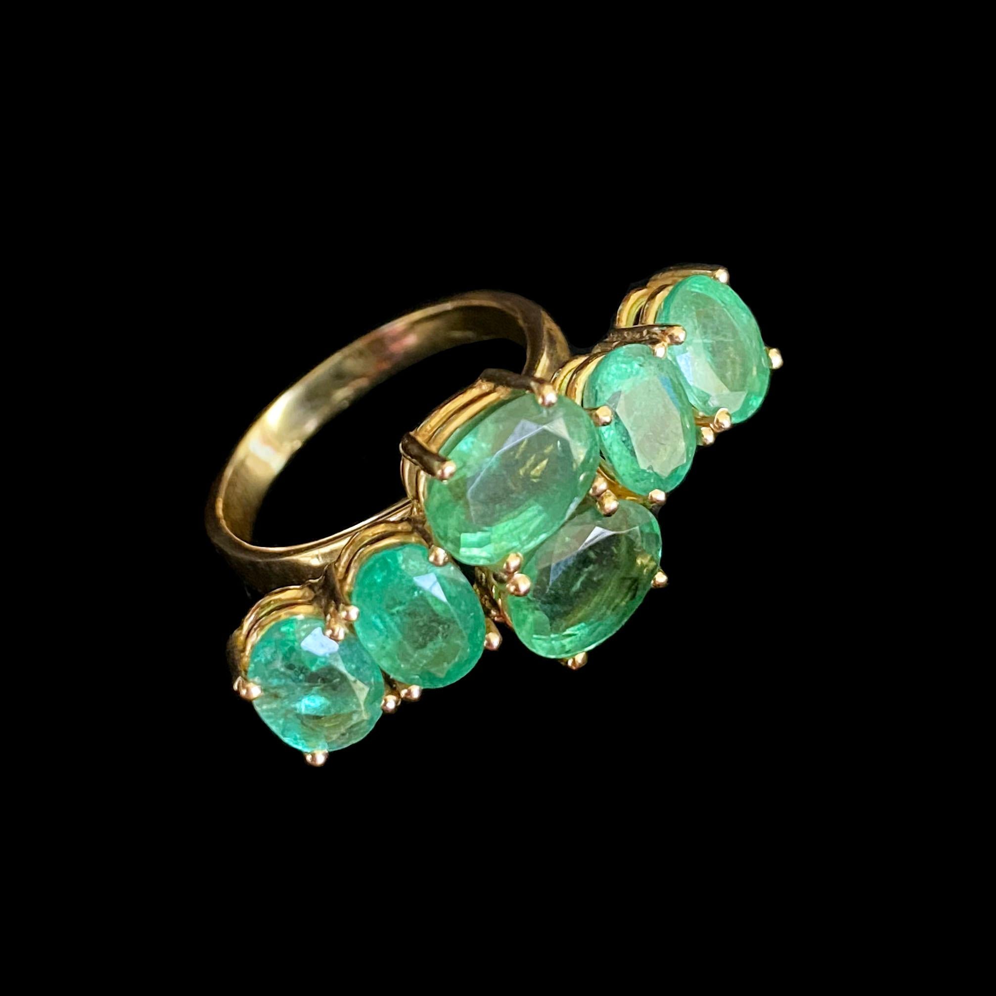Stunning Custom Ring by Marina J.

This Ring features stunning bright green Vintage cut Emeralds all set in solid 14k Yellow Gold. The Emeralds were originally a Brooch that has been reworked into this beautiful Centerpiece, that radiates a bright,