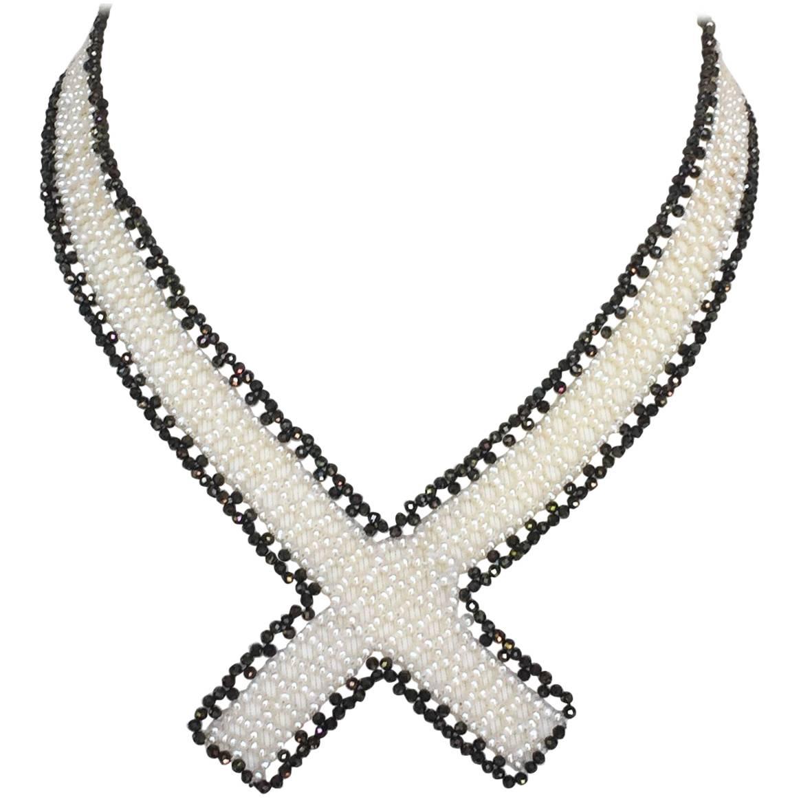 This Marina J original design is an elegant and eye catching piece. The white pearl and black spinel woven band crosses at the end to create a beautiful collar that accentuates the neckline. The sliding gold plated silver clasp is easy to use and