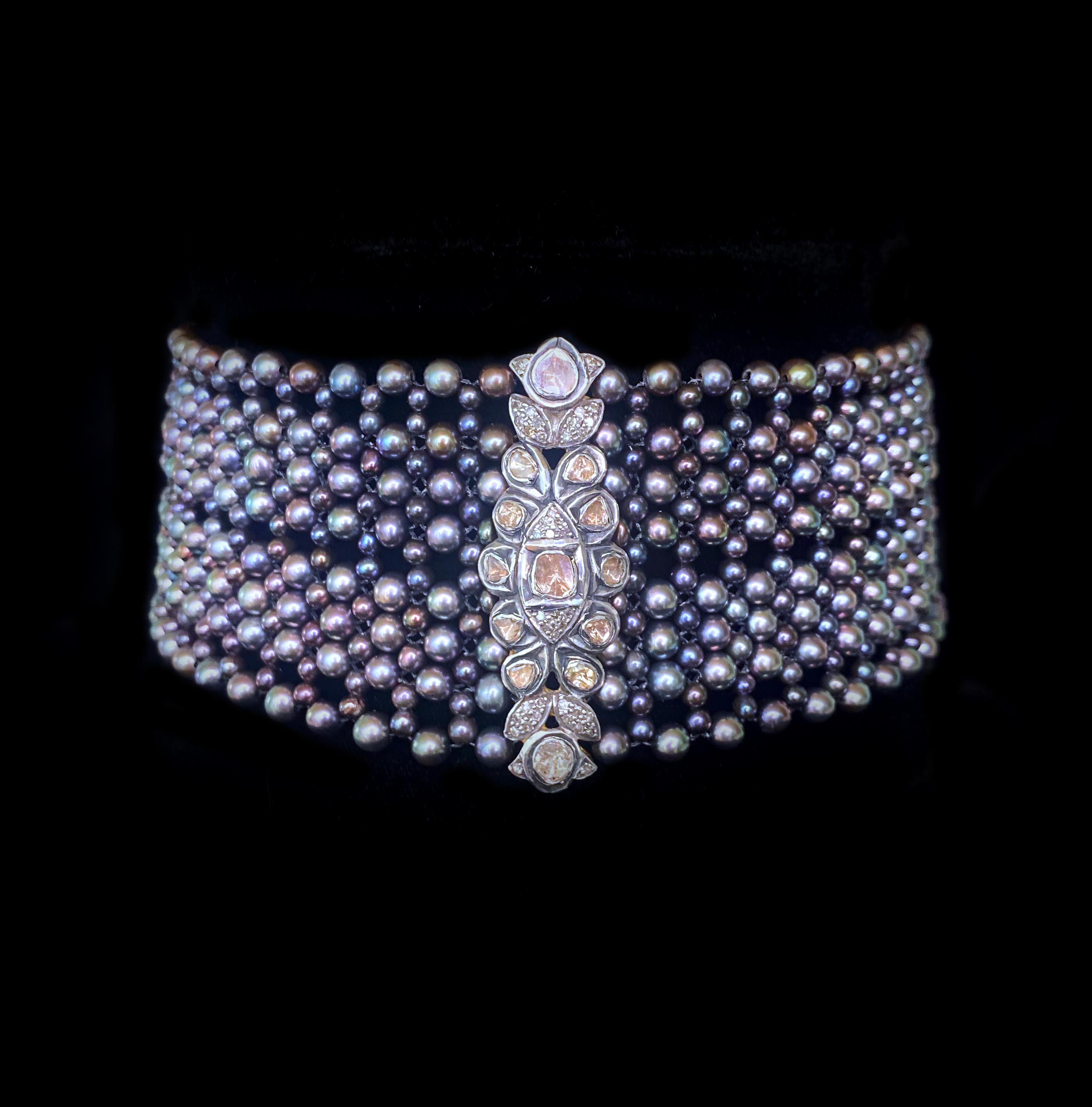 Beautiful piece by Marina J. This choker features highly lustrous and iridescent Black Pearls which display an 