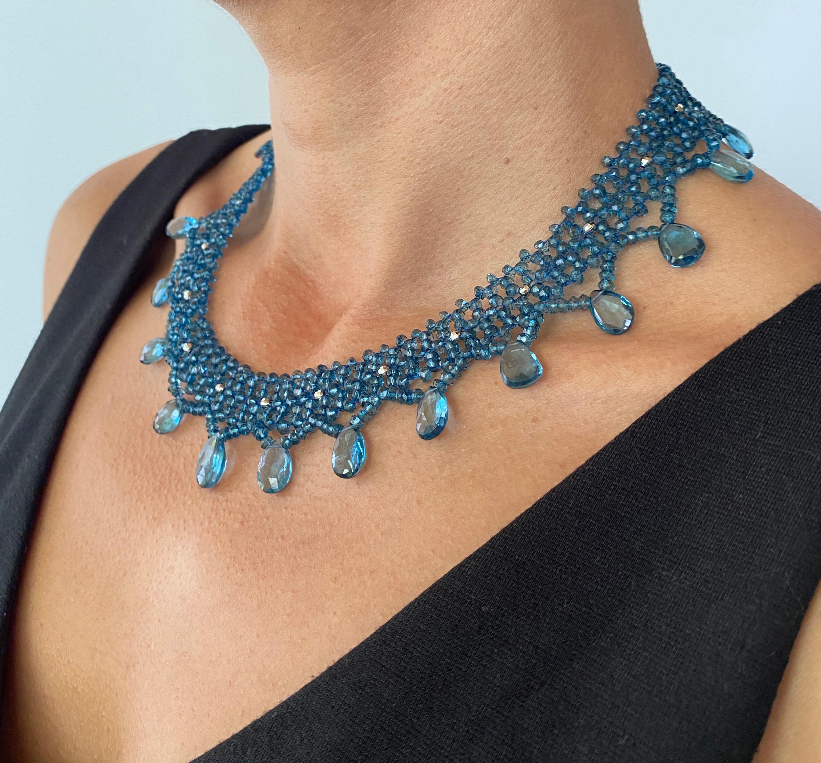 This intricately woven necklace features brilliant London Blue Topaz.beads .  The vibrancy of these beads and briollettes illuminate a perfect blue glow. Faceted Rhodium plated Sterling Silver beads add pops of shine that perfectly compliment the