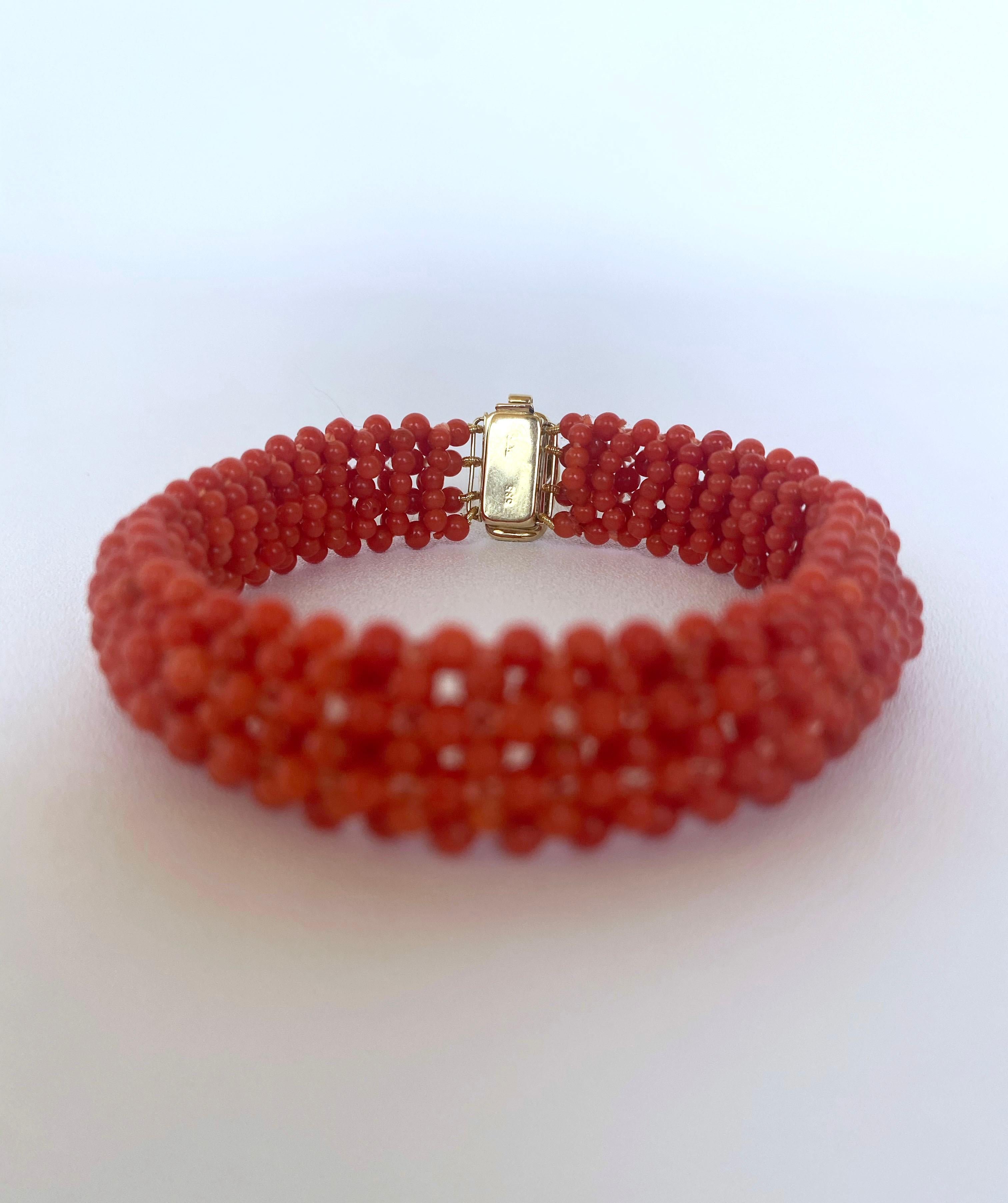 Simple yet classic Marina J. piece. This hand made bracelet features beautiful Mediterranean Coral beads intricately woven together into a fine lace like design. The Coral displays a beautiful Red/ Orange huge which perfectly matches the vintage 14K