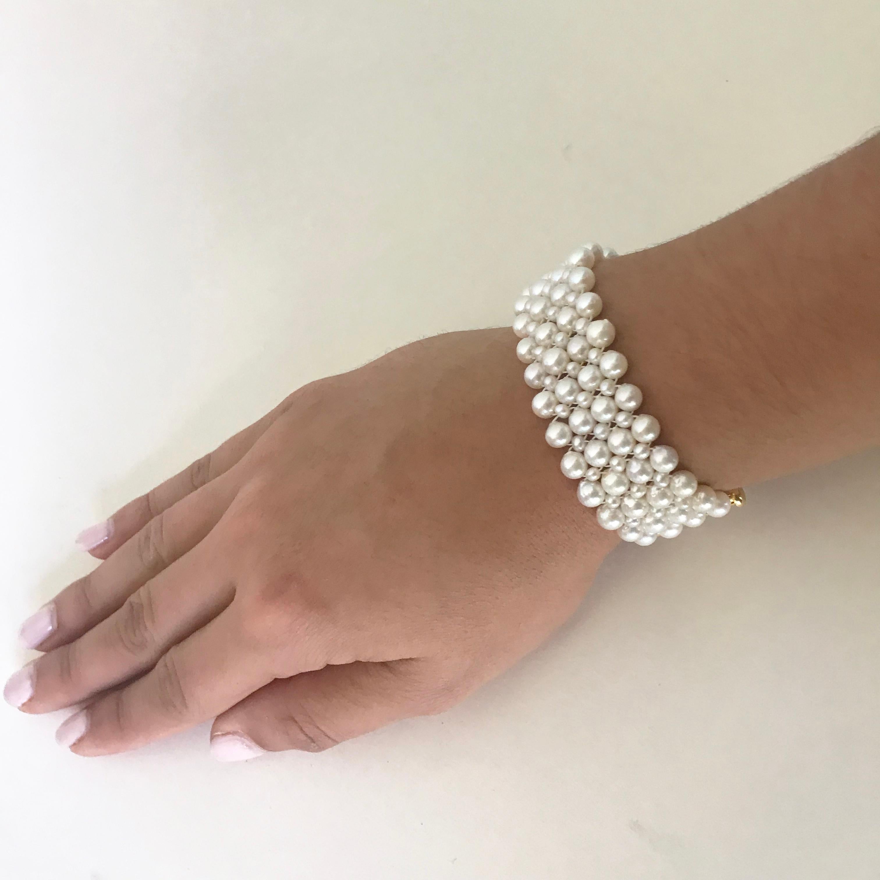 This beautiful, classic and timeless bracelet has elegant pearl weave. At a 1 inch wide the different size pearls (5mm to 2mm) create a checkered design with the sterling silver yellow gold plated clasp.  It is easy to use and secure once fitted on