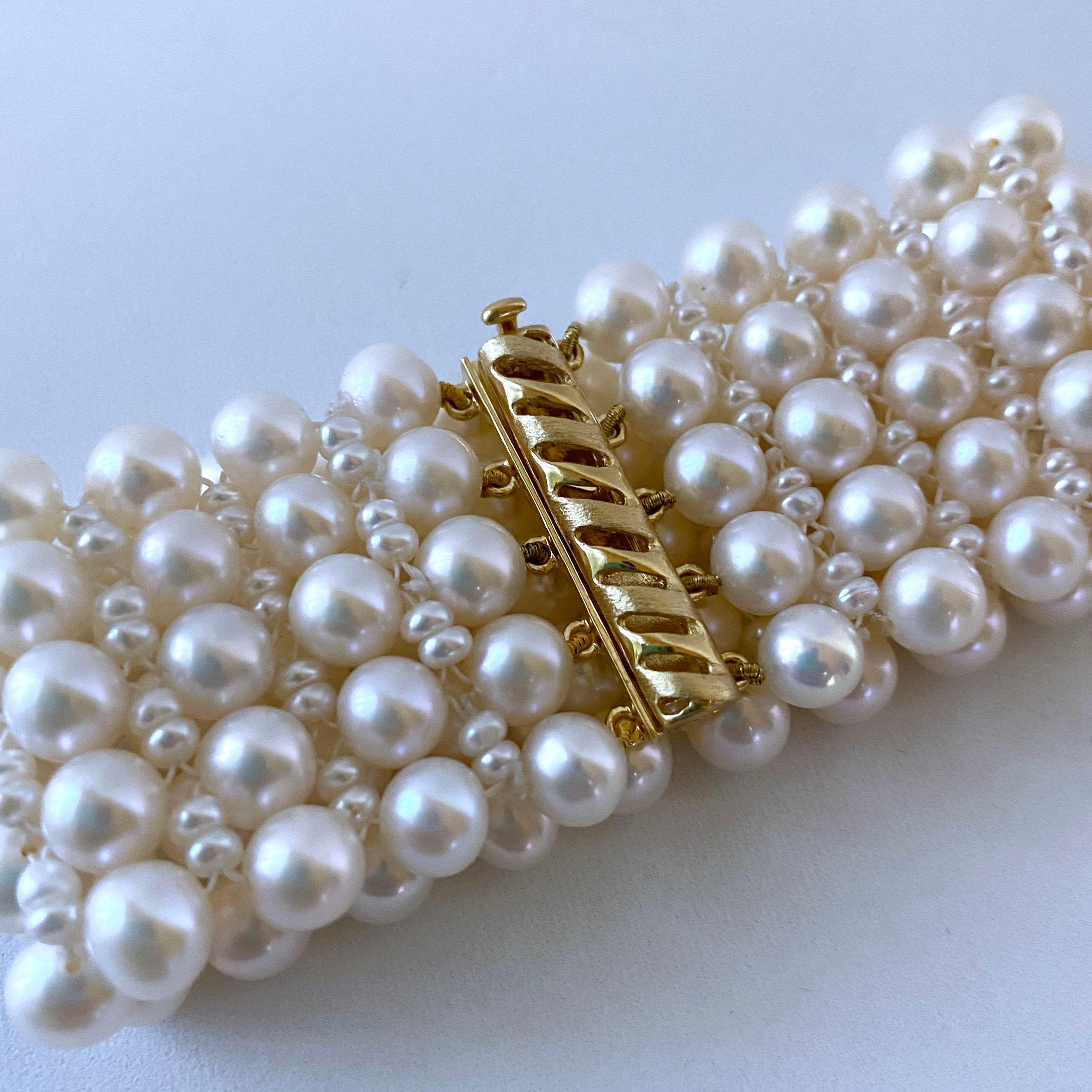 Gorgeous and classic piece by Marina J. This bracelet is made from all multi sized cultured White Pearls with a soft iridescent luster, all intricately woven together into a fine lace like design. The lace weaving gives a regal and elegant feel, and