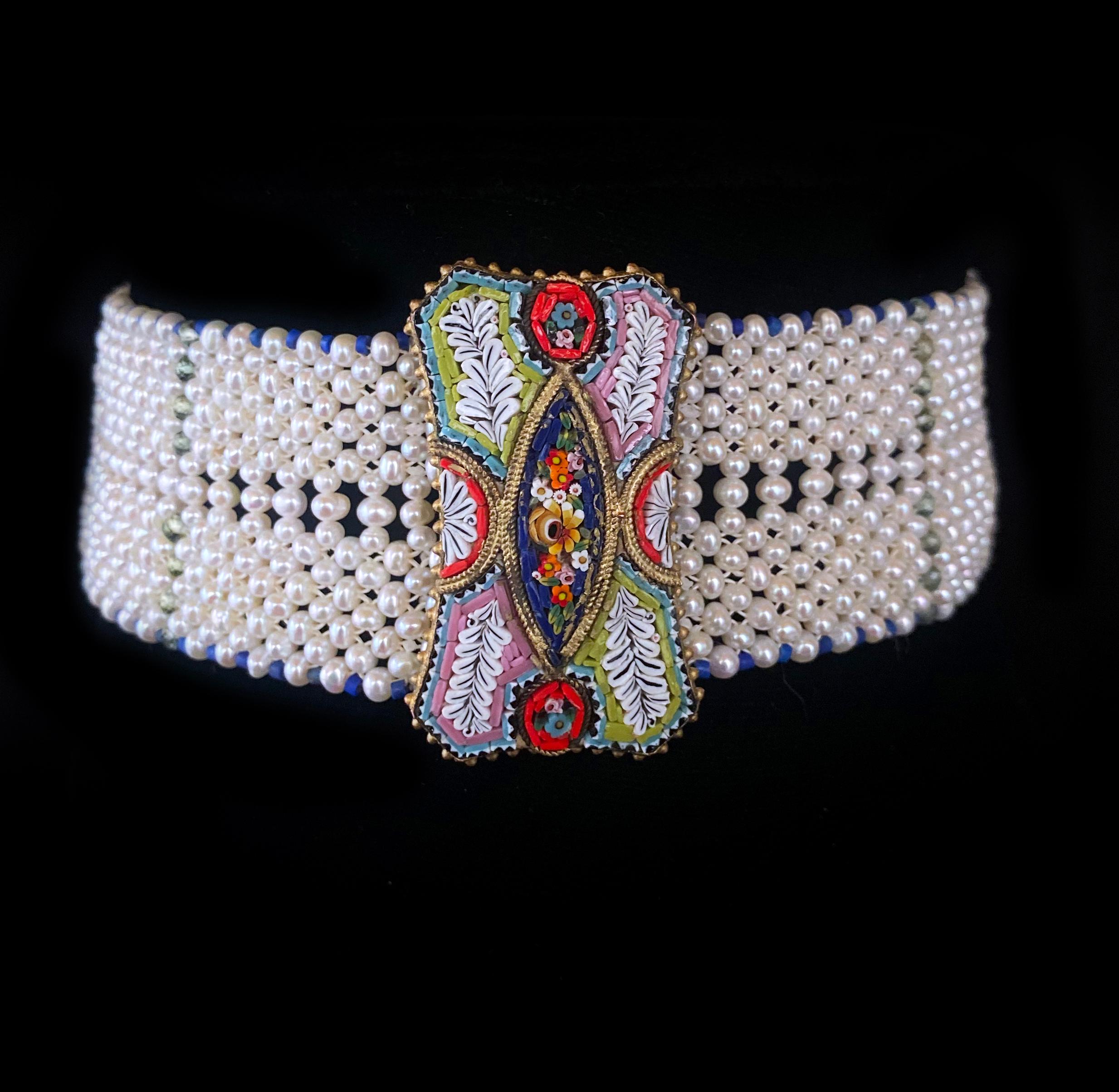 Beautiful piece made by Marina J. This lovely choker features high luster White Seed Pearls, all woven together into a fine lace like design. The Pearl band is adorned in beautiful Lapis Lazuli and Green Apatites which perfectly match the