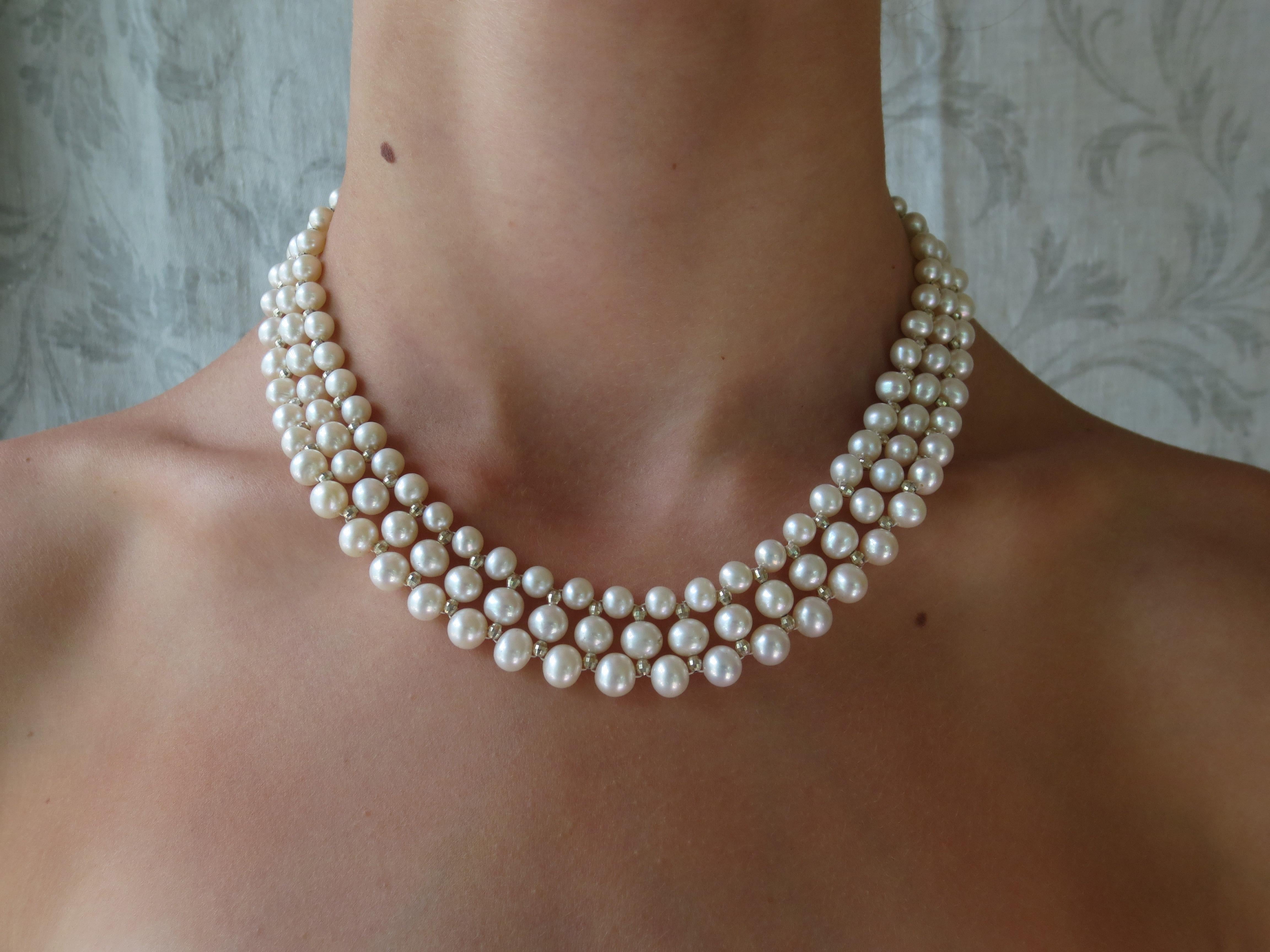 This woven white pearl necklace with 14k white gold faceted beads and sliding clasp glitters beautifully. This classic necklace is handmade by Marina J. with 14k white gold faceted beads and glowing white pearls woven together in an elegant design.